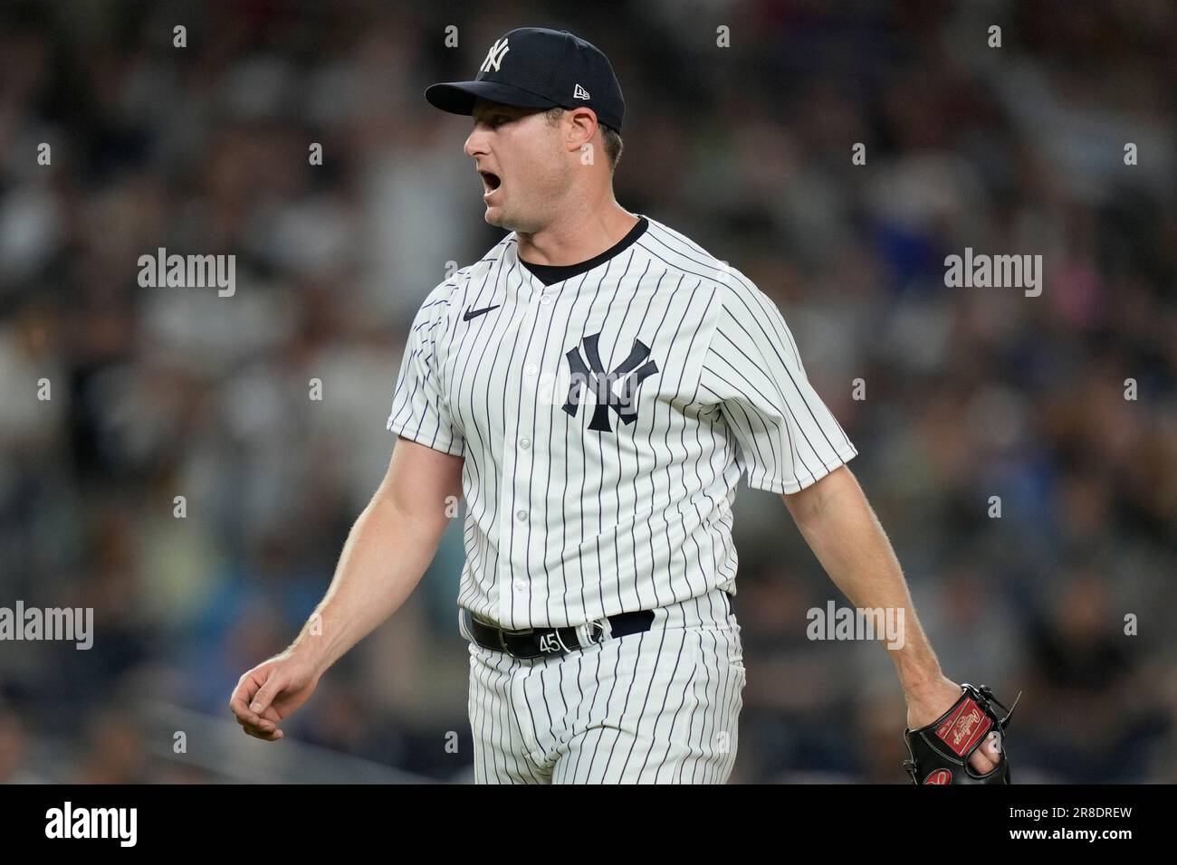 New York Yankees starting pitcher Gerrit Cole yells towards home plate