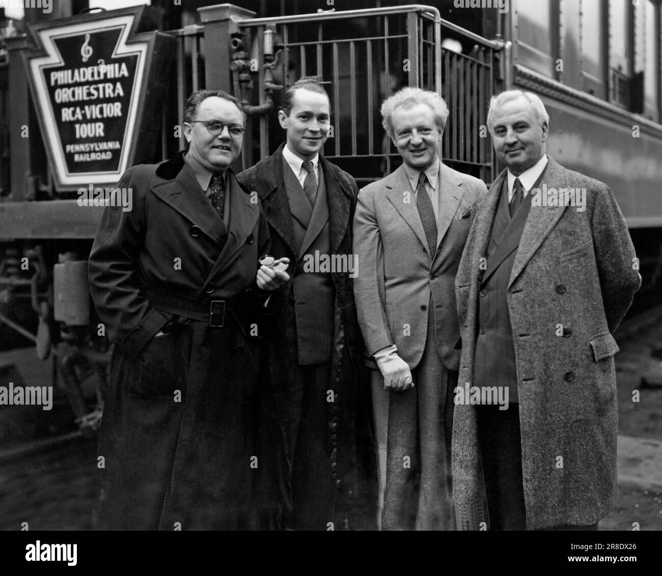 Los Angeles, California,  1936. Noted conductor of the Philadelphia Orchestra, Leopold Stokowski arrives in LA on the RCA-Victor Tour with L-R: Merle Armitage, Franchot Tone, Stokowski, and Charles L Wagner. Stock Photo