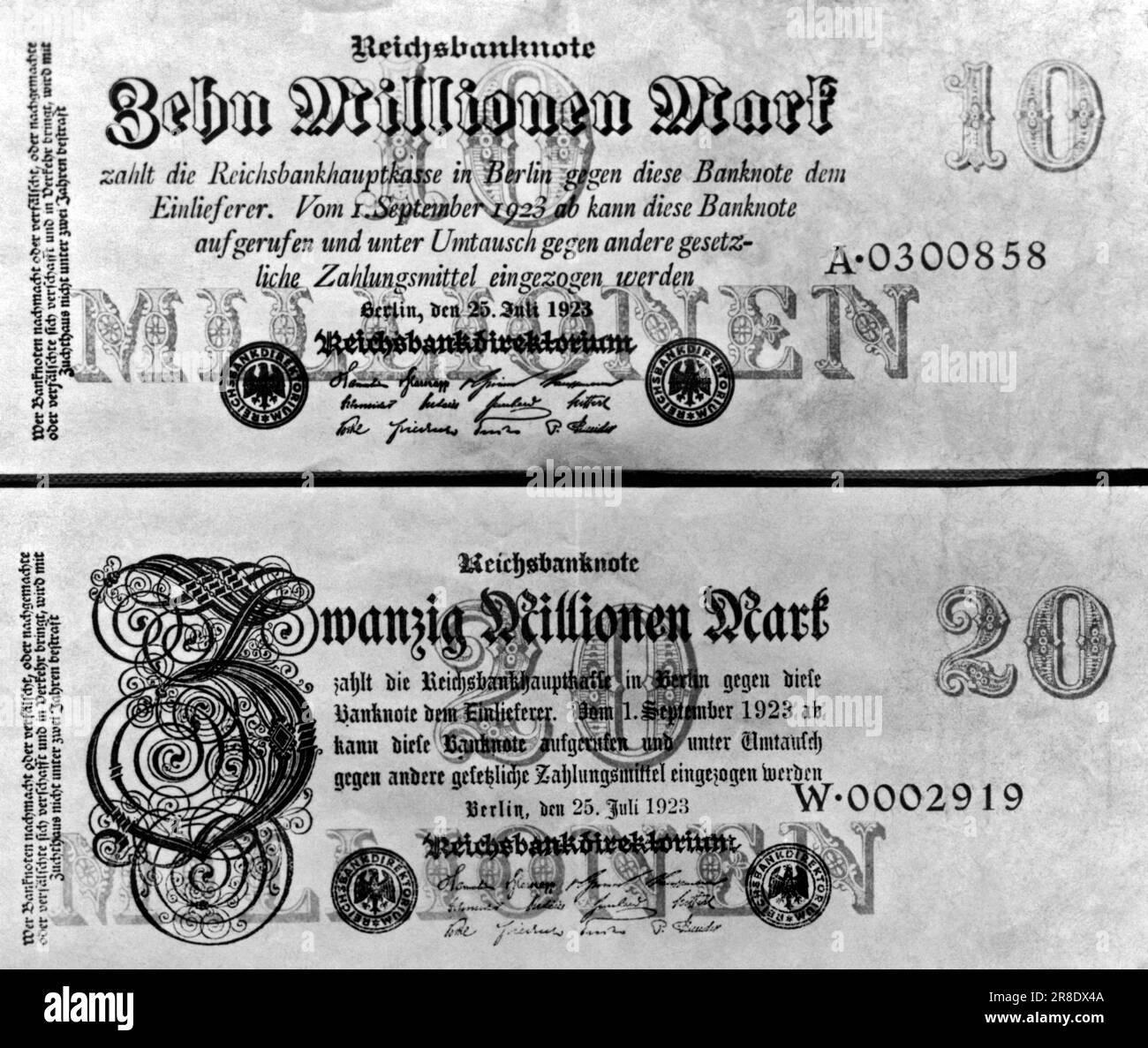 Berlin, Germany: 1923. A German ten and twenty million mark bill in July of 1923. They are the highest denomination ever printed, and Germany expects them to help her evade the present money scarcity. The exchange rate later in December 1923, was between 3.4 to 5.72 billion marks to the dollar. In January of 1923 it was between 7,000 to 48,000 marks to the dollar. Stock Photo