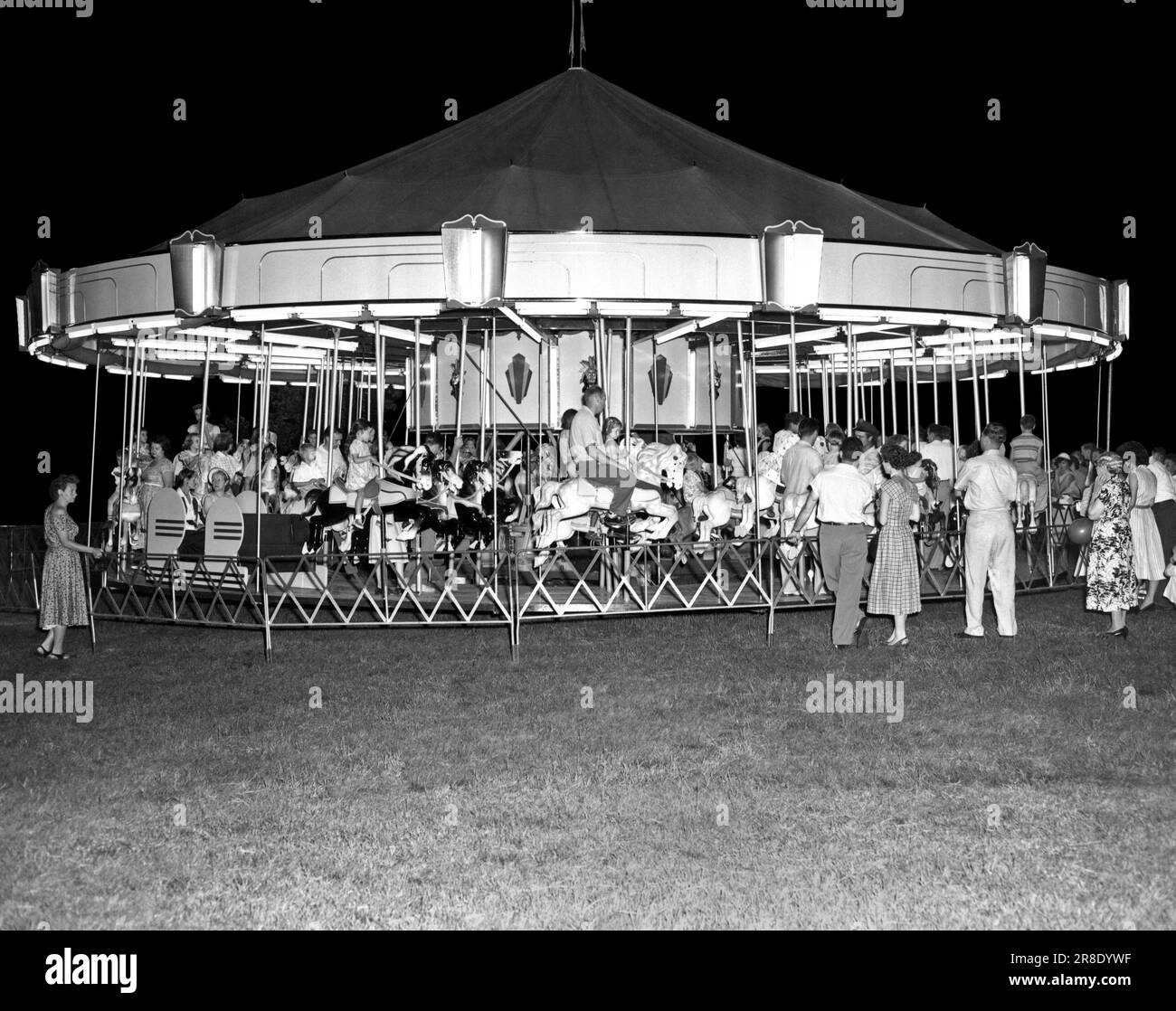 Springfield, Ohio c. 1960. A Gooding Amusement carousel at a carnival