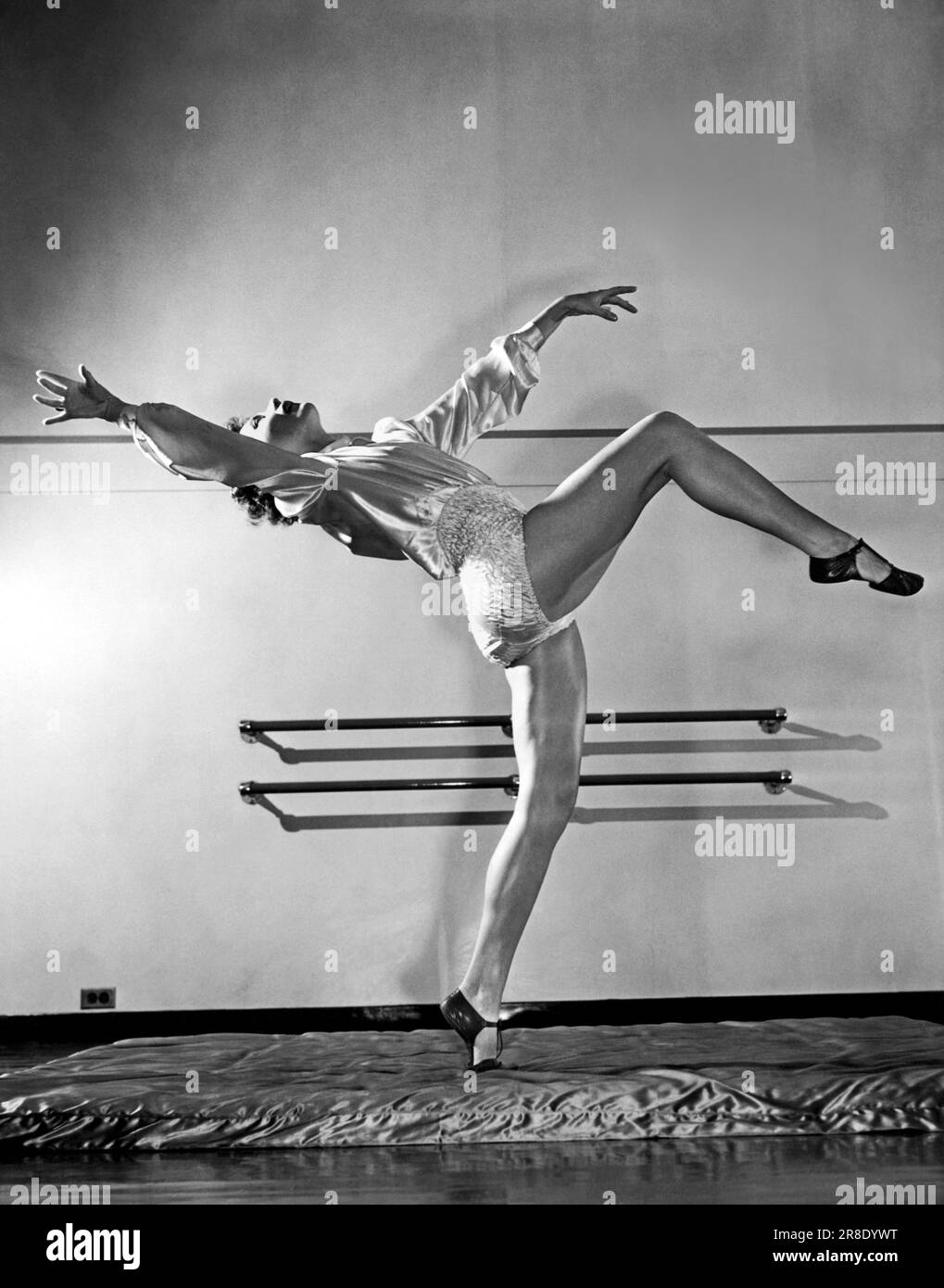 United States 1940. A dance instructor demonstrates how to step