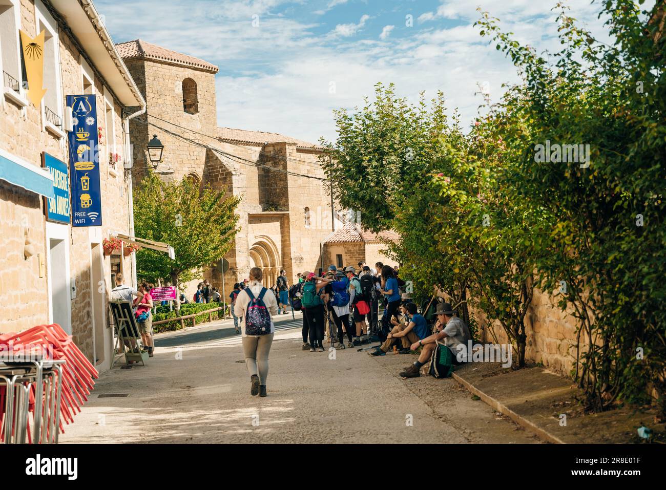 xterior of store selling religious items with motion blurred tourists and pilgrims in foreground. spain - may 2023. High quality photo Stock Photo