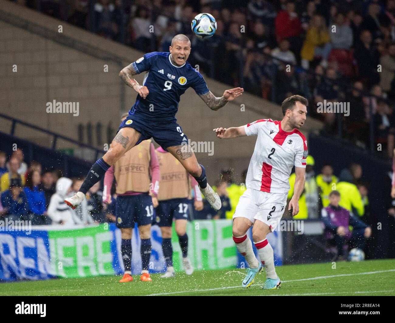 GLASGOW, SCOTLAND - JUNE 20: A high flying Scotland forward, Lyndon Dykes, during the UEFA EURO 2024 qualifying round group A match between Scotland and Georgia at Hampden Park on June 20, 2023 in Glasgow, Scotland. (Photo by Ian Jacobs/MB Media/) Stock Photo