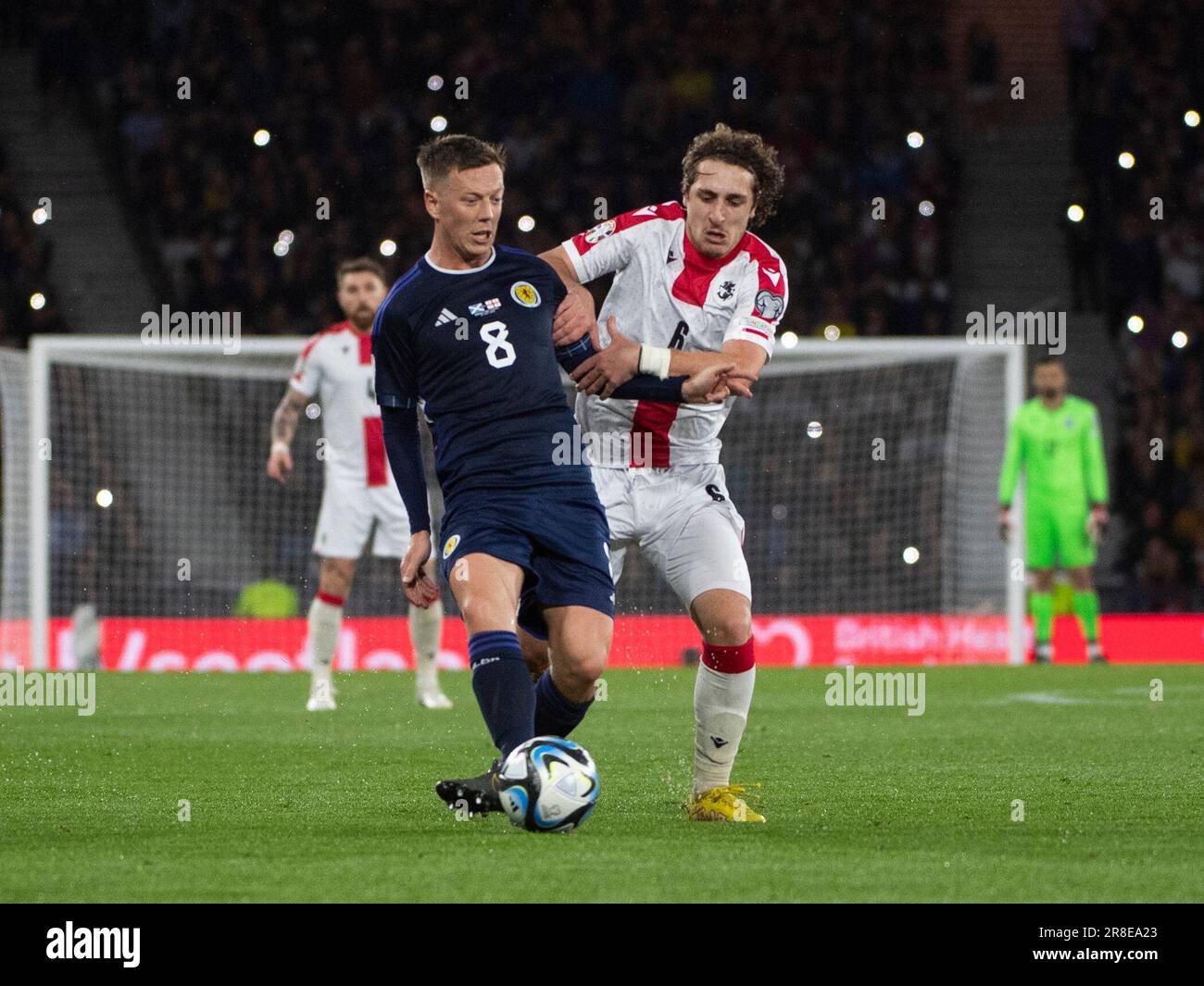 GLASGOW, SCOTLAND - JUNE 20: Georgia midfielder, Luka Gagnidze, attempts to tackle Scotland midfielder, Callum McGregor, during the UEFA EURO 2024 qualifying round group A match between Scotland and Georgia at Hampden Park on June 20, 2023 in Glasgow, Scotland. (Photo by Ian Jacobs/MB Media/) Stock Photo