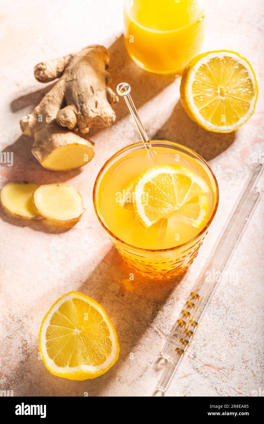 Ginger and lemon refreshing lemonade or cocktail, immunotherapy drink Stock Photo