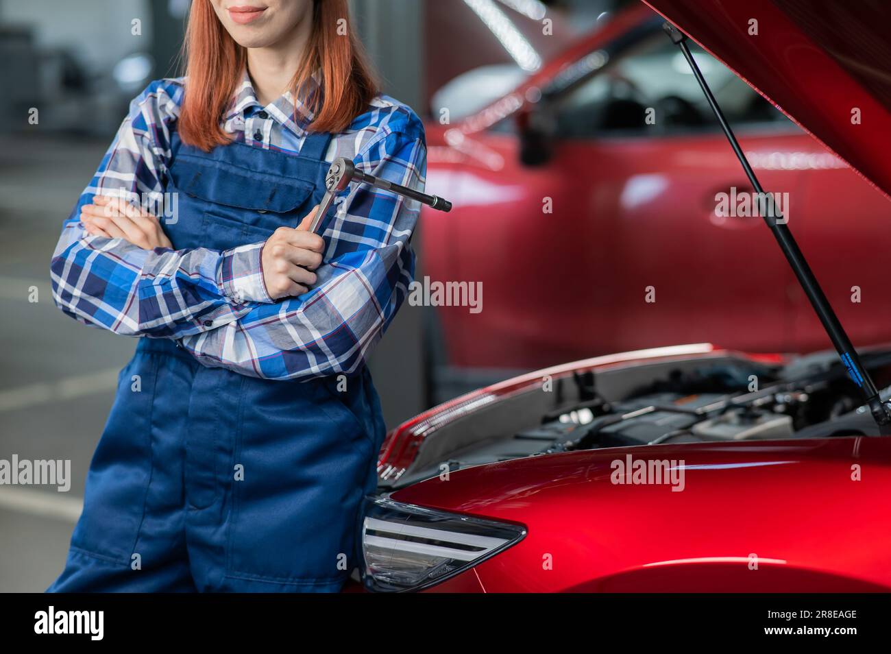 Woman auto mechanic stands hi-res stock photography and images - Alamy
