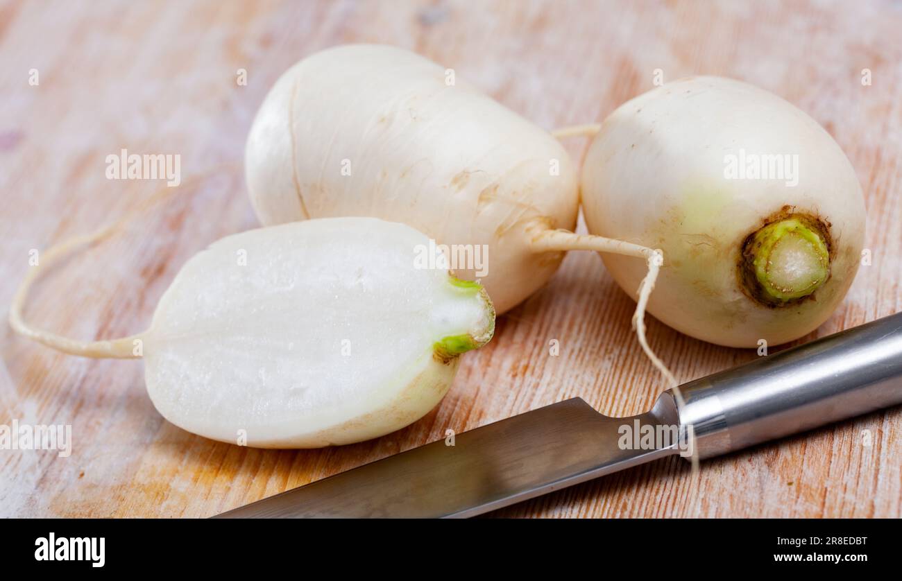 Whole and cut in half turnips Stock Photo Alamy