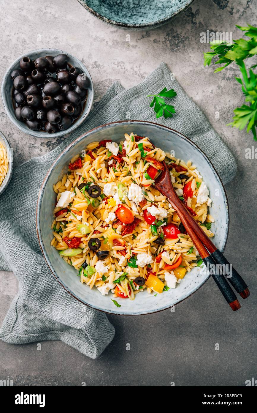 Homemade orzo pasta salad with feta, olives, tomatoes Stock Photo Alamy