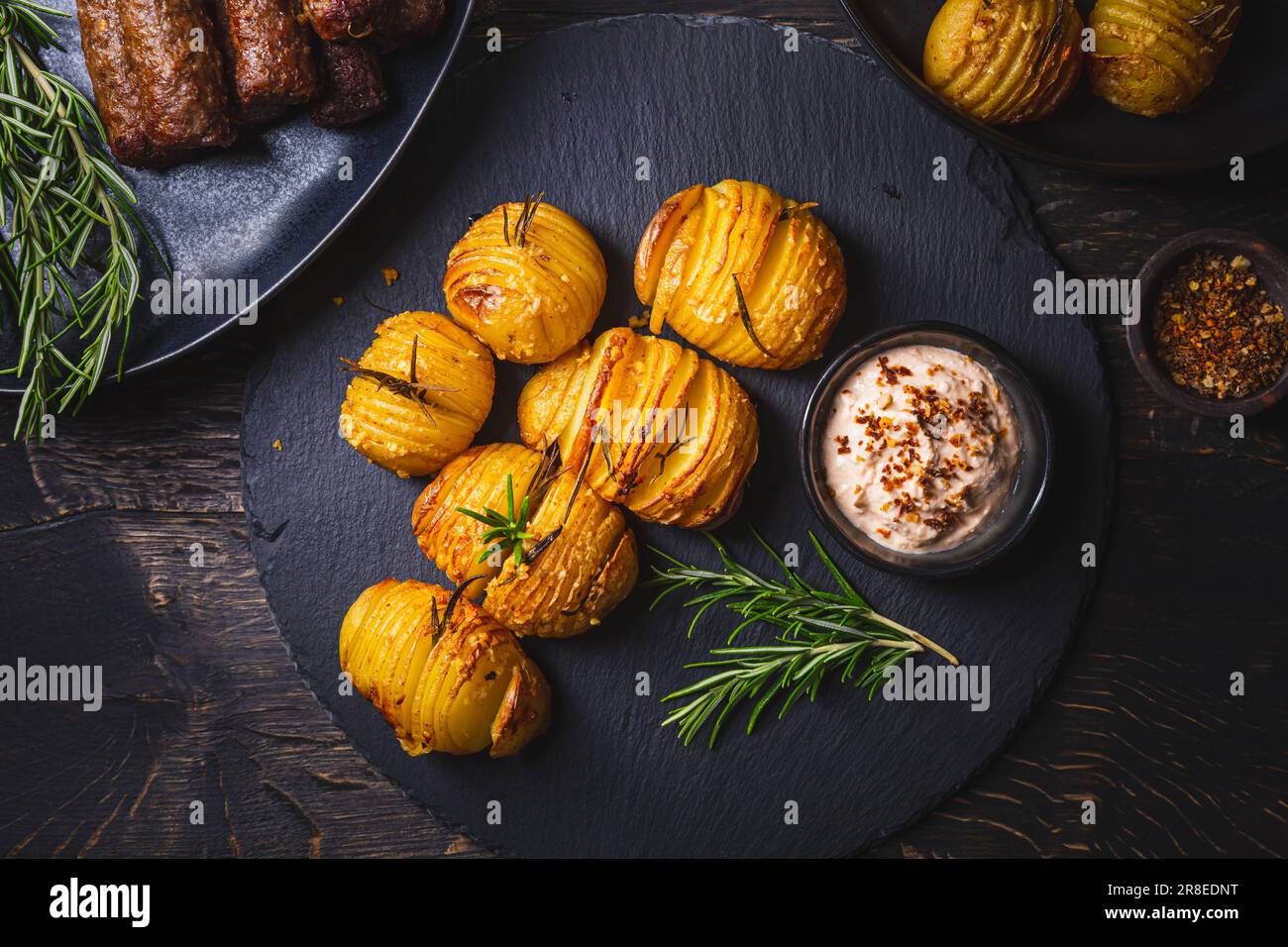 Hasselback potatoes (potato fans) with additional herbs, spices and