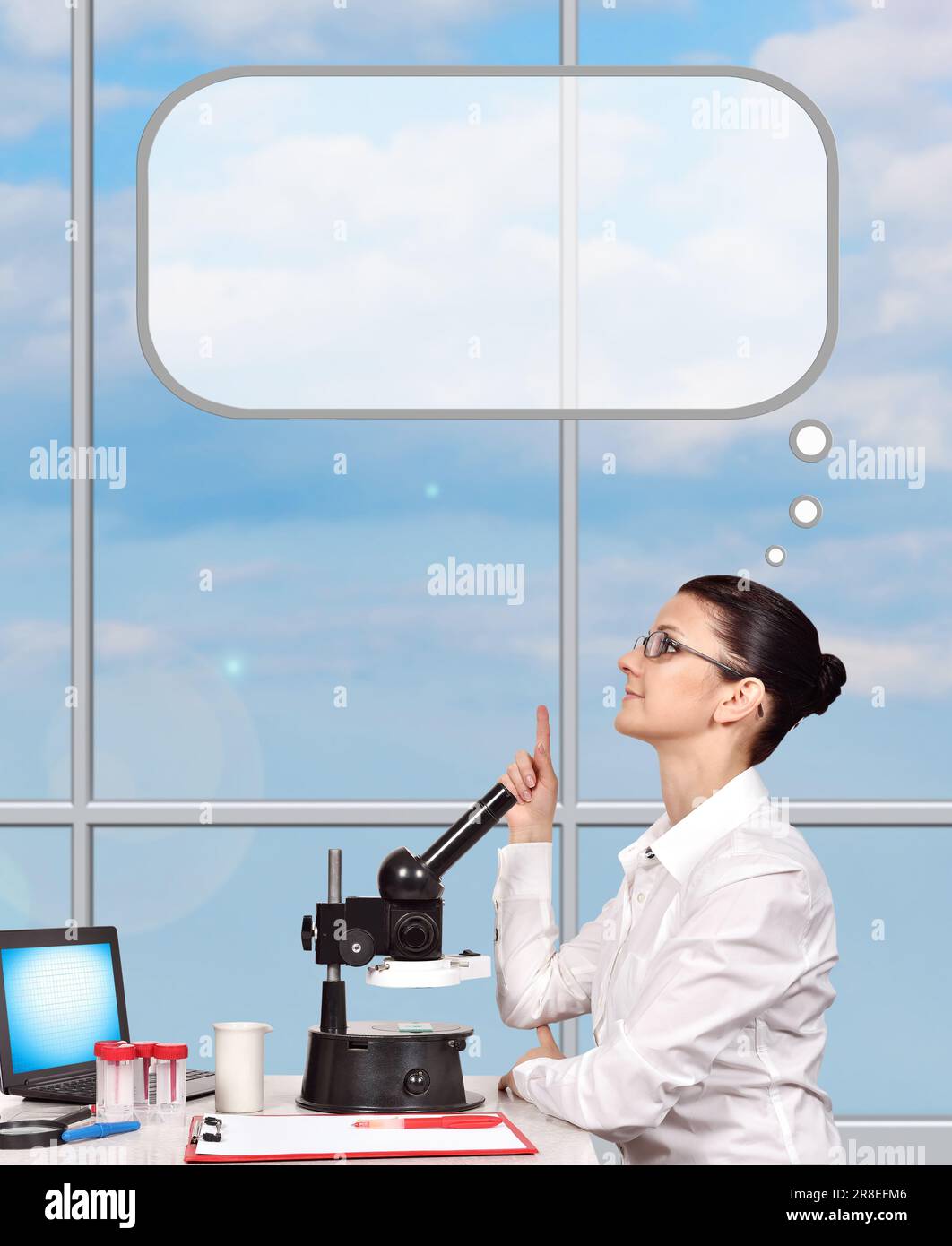 young woman scientific researcher sitting in laboratory and thinking Stock Photo