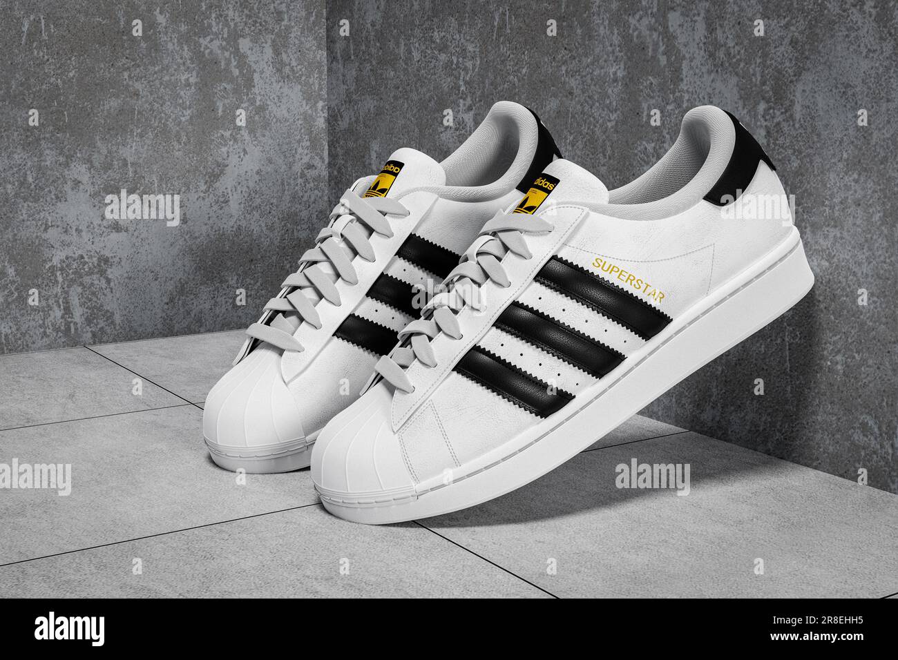 New York, USA - June 20 , 2023 : Adidas Superstar original white sneakers.  Sport and fashion footware. white and black sneaker on grey concrete urban  Stock Photo - Alamy