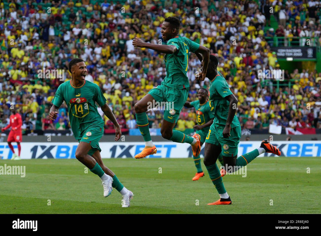 Lisbon, Portugal. 20th June, 2023. Ismail Joshua Jackobs from Senegal (L), Mouhamadou Habibou Diallo from Senegal (C) and Pape Alassane Gueye from Senegal (R) celebrate a goal during friendly football match between Brazil and Senegal at Estadio Jose Alvalade. Final Score: Brazil 2:4 Senegal Credit: SOPA Images Limited/Alamy Live News Stock Photo