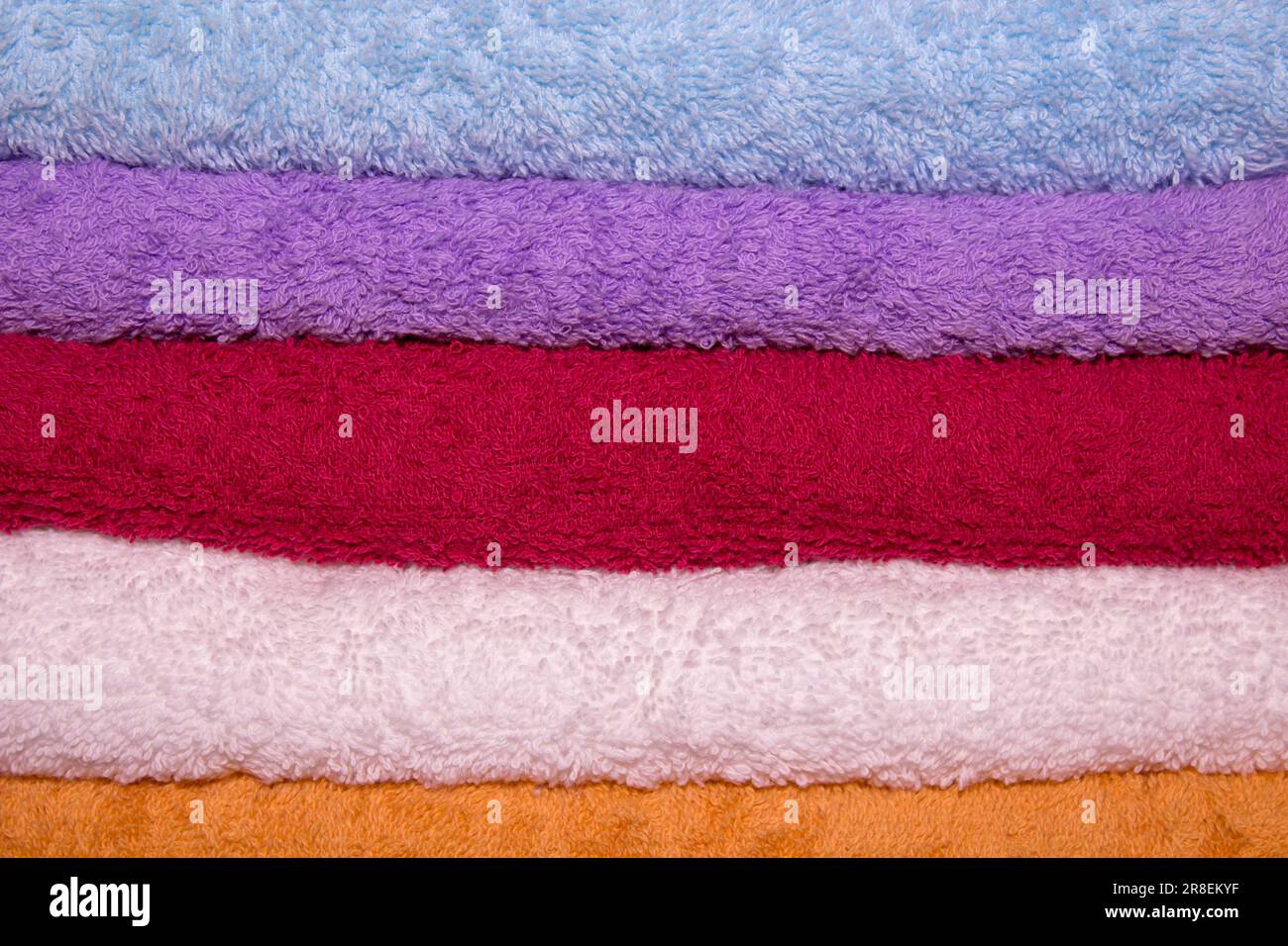 Pile of rainbow colored towels isolated Stock Photo Alamy