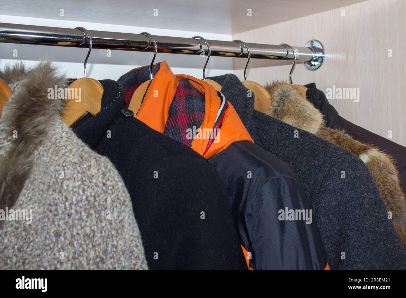 Winter clothing and coat hanger hi-res stock photography and