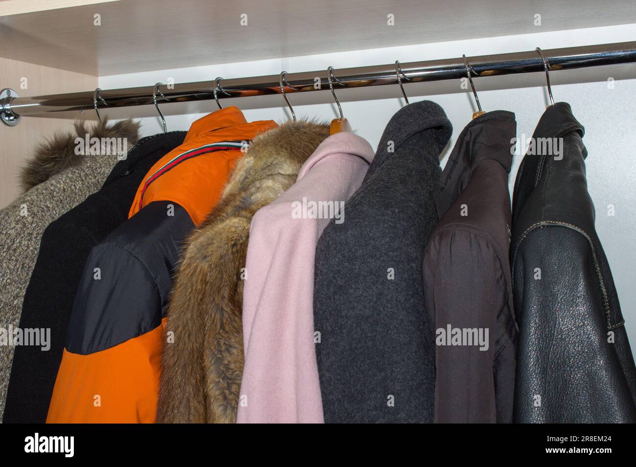 winter wardrobe,winter outerwear in the closet hanging Stock Photo