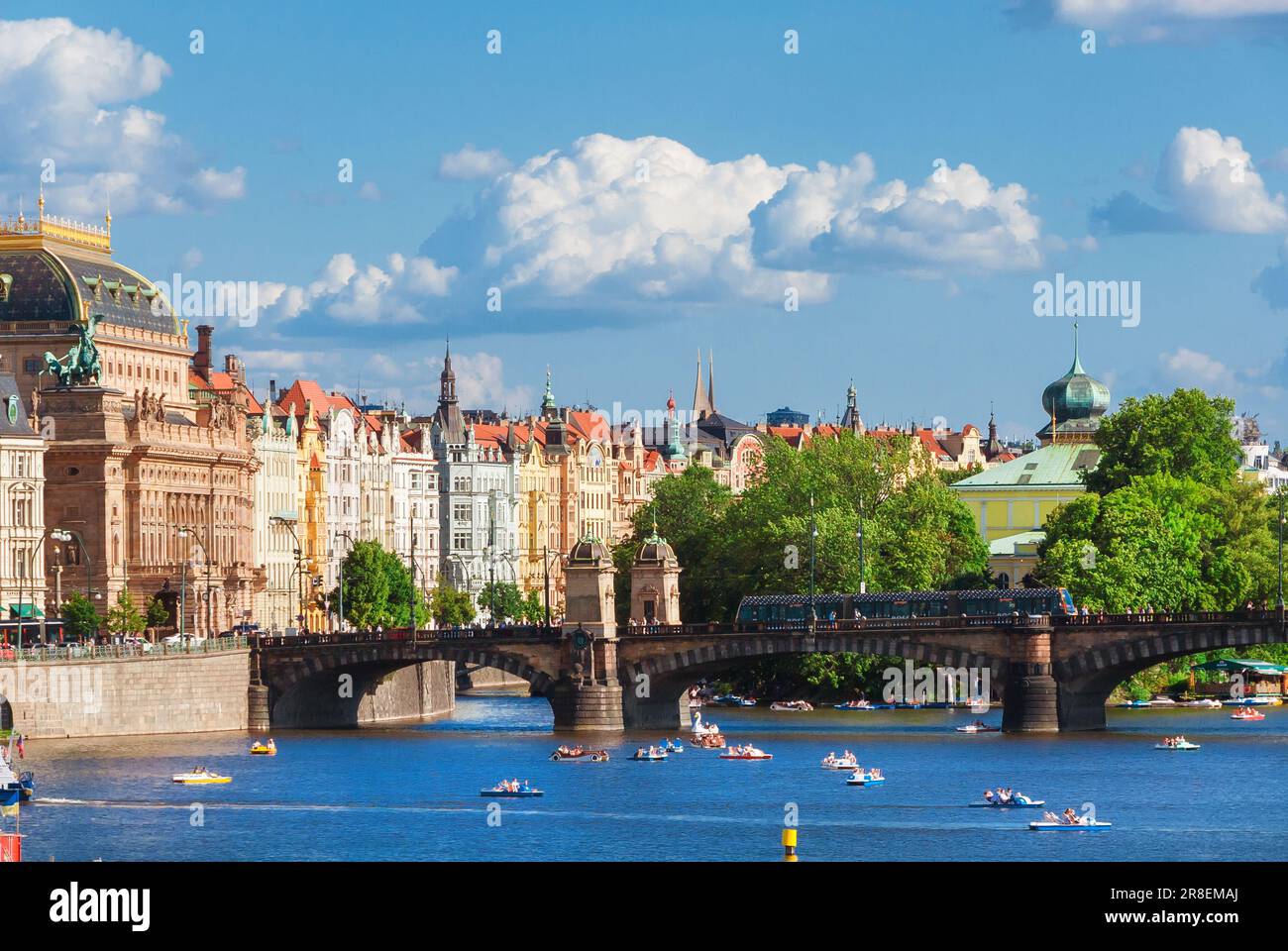 Tourism in Prague. Paddle boats around Legion Bridge on River Vltava