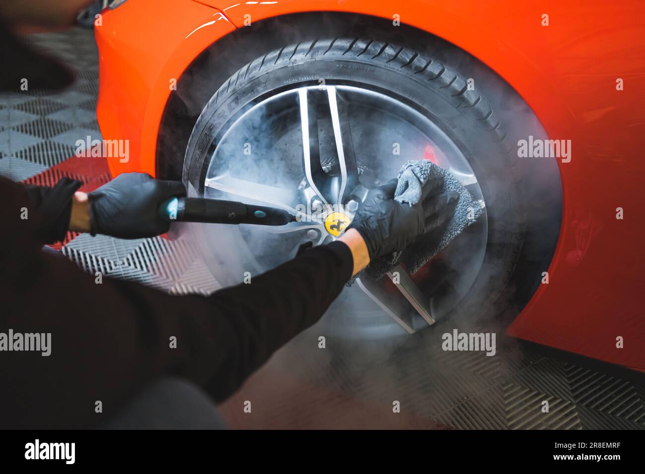 05.17.2023 Warsaw, Poland. Deep cleaning car detailing concept. Cleaning  wheels of a red Ferrari with steam. . High quality photo Stock Photo - Alamy