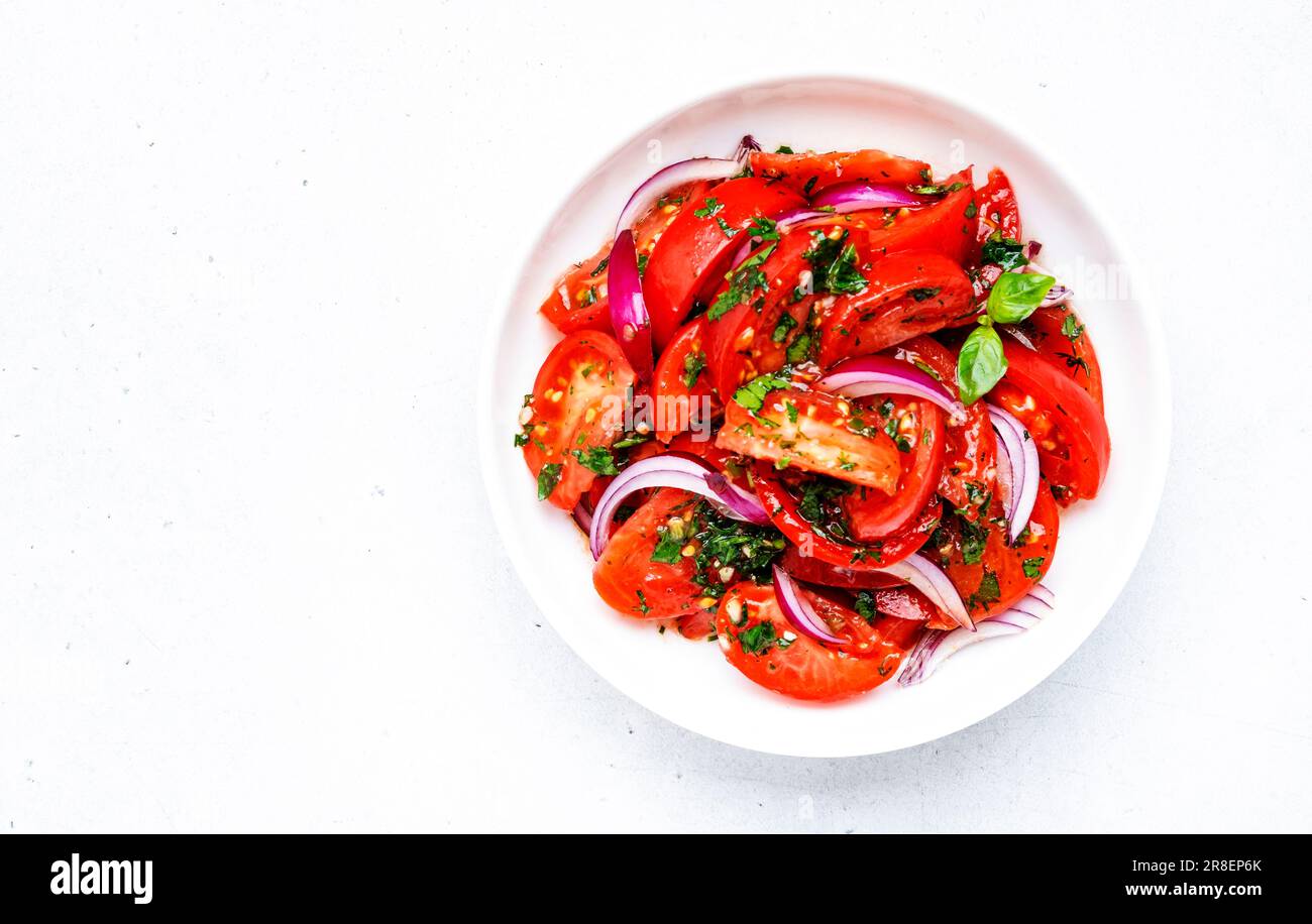 Tomato and onion salad with parsley, garlic, jalapeno and olive oil