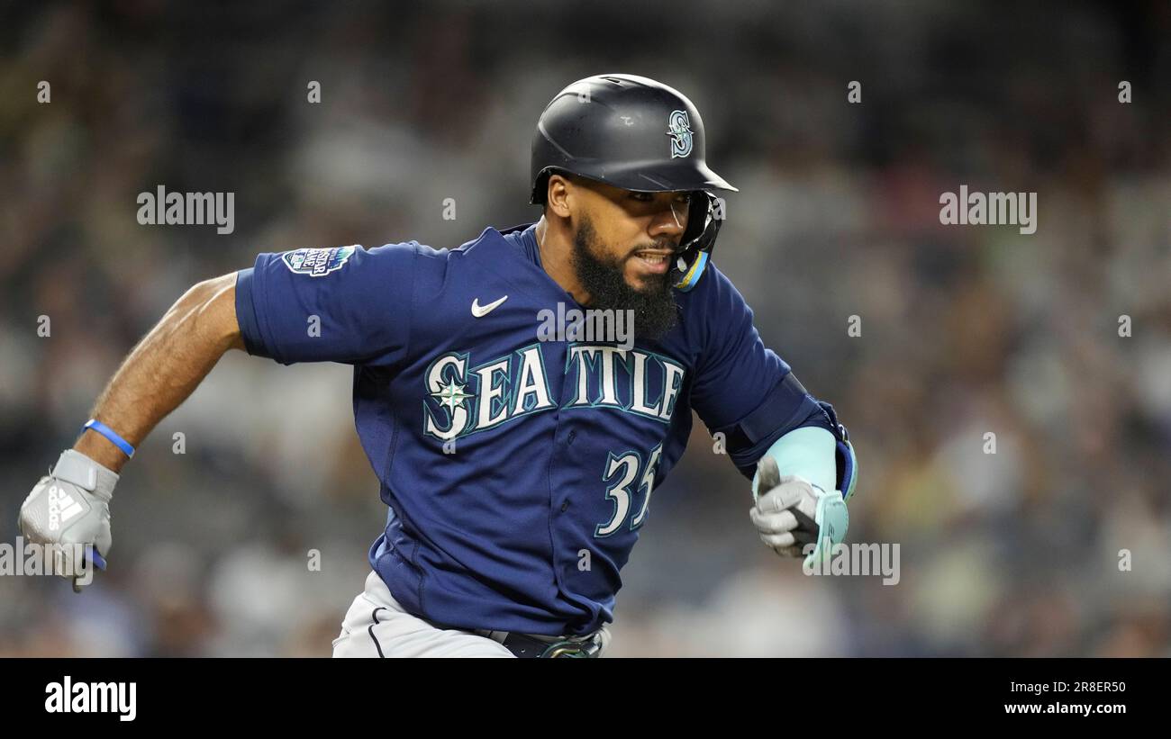 Seattle Mariners' Teoscar Hernandez runs to first on a ground ball hit