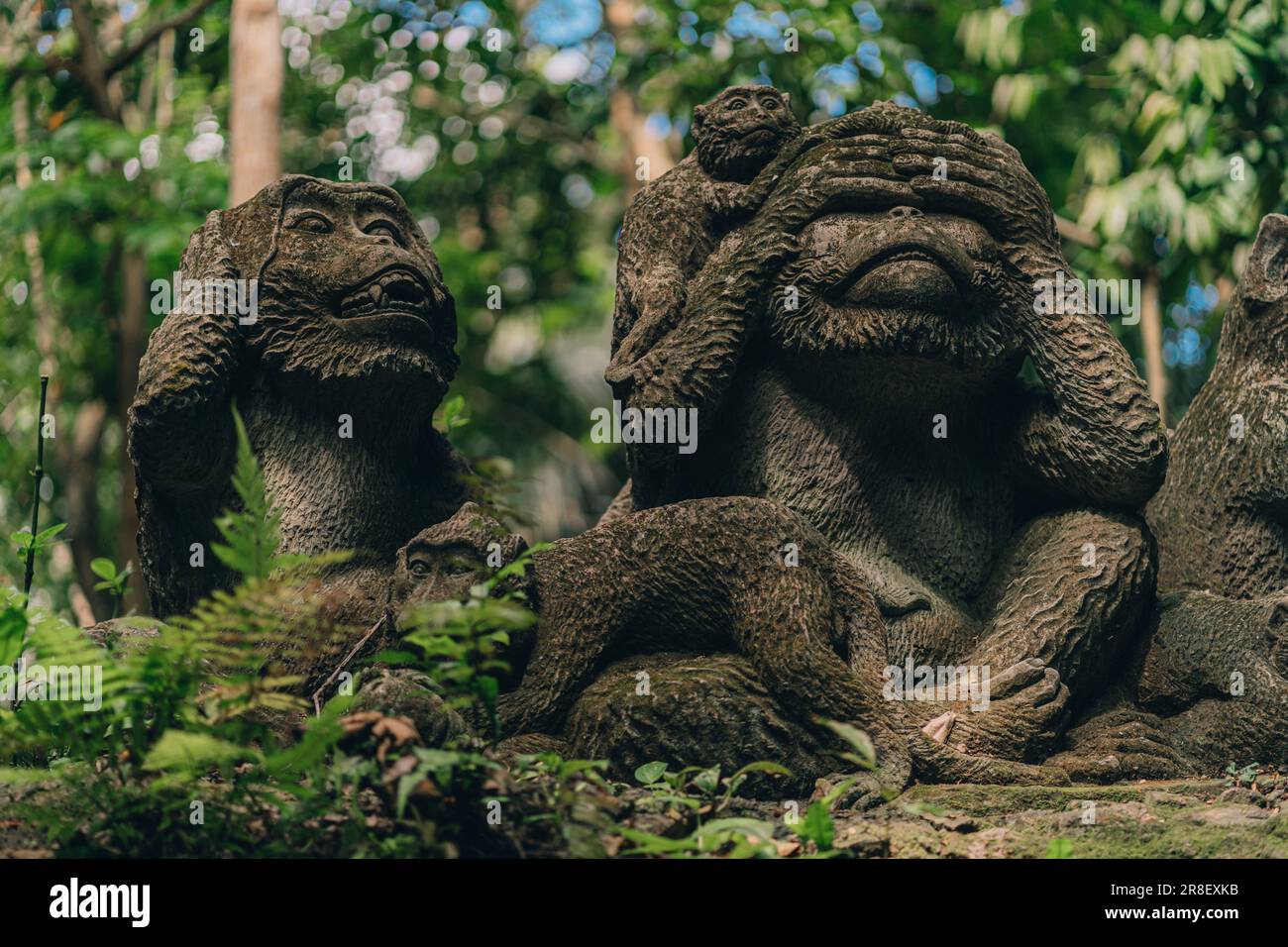 Stone monkeys statues in sacred monkey forest. Old decorative monkey