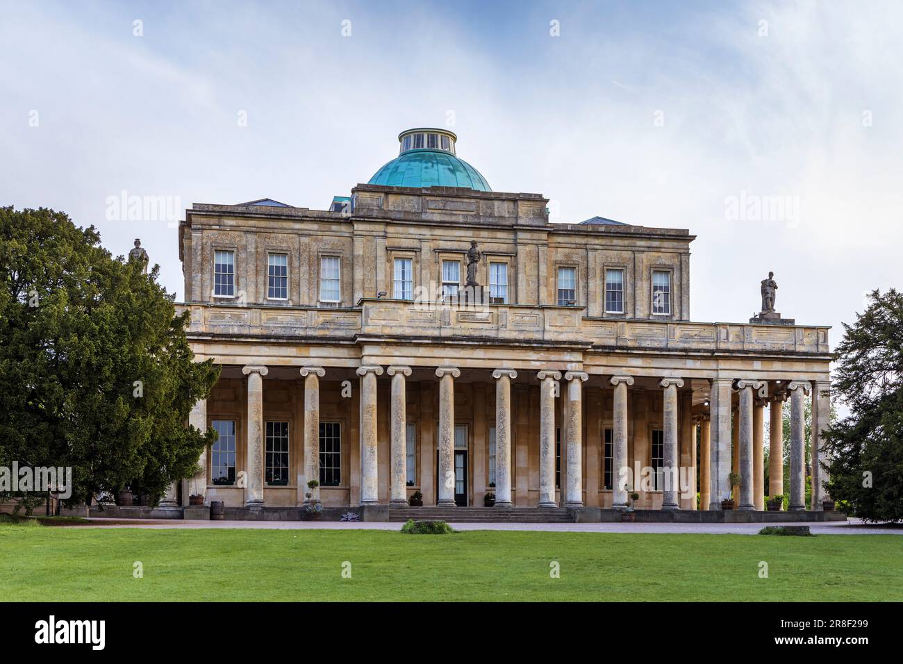 Pittville Pump Room and old spa mineral water buildings in Pittville Park, Cheltenham, Gloucestershire, England Stock Photo