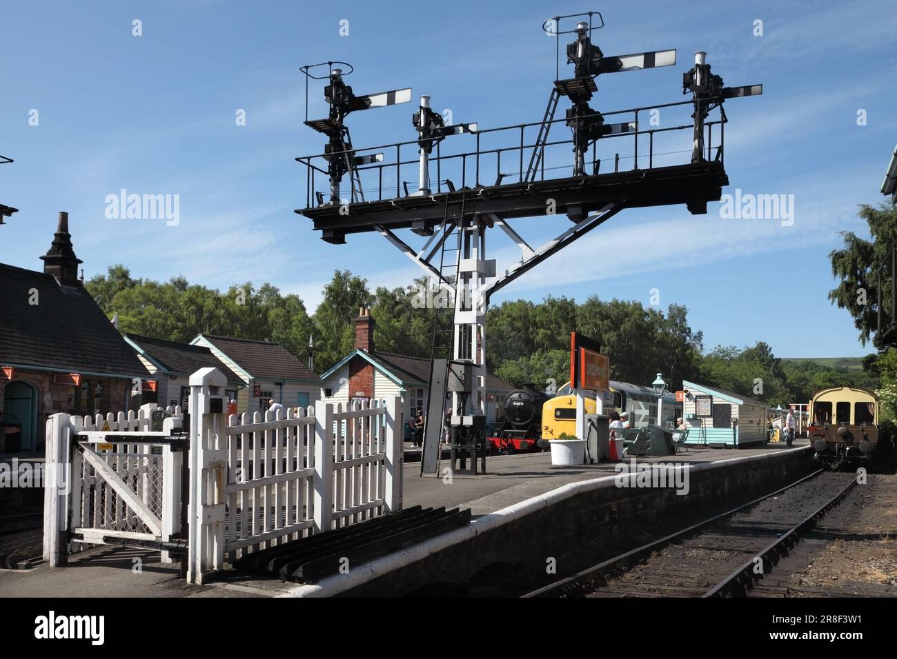 Semaphore signal gantry at Grosmont station, North Yorkshire Moors Railway, UK. Stock Photo