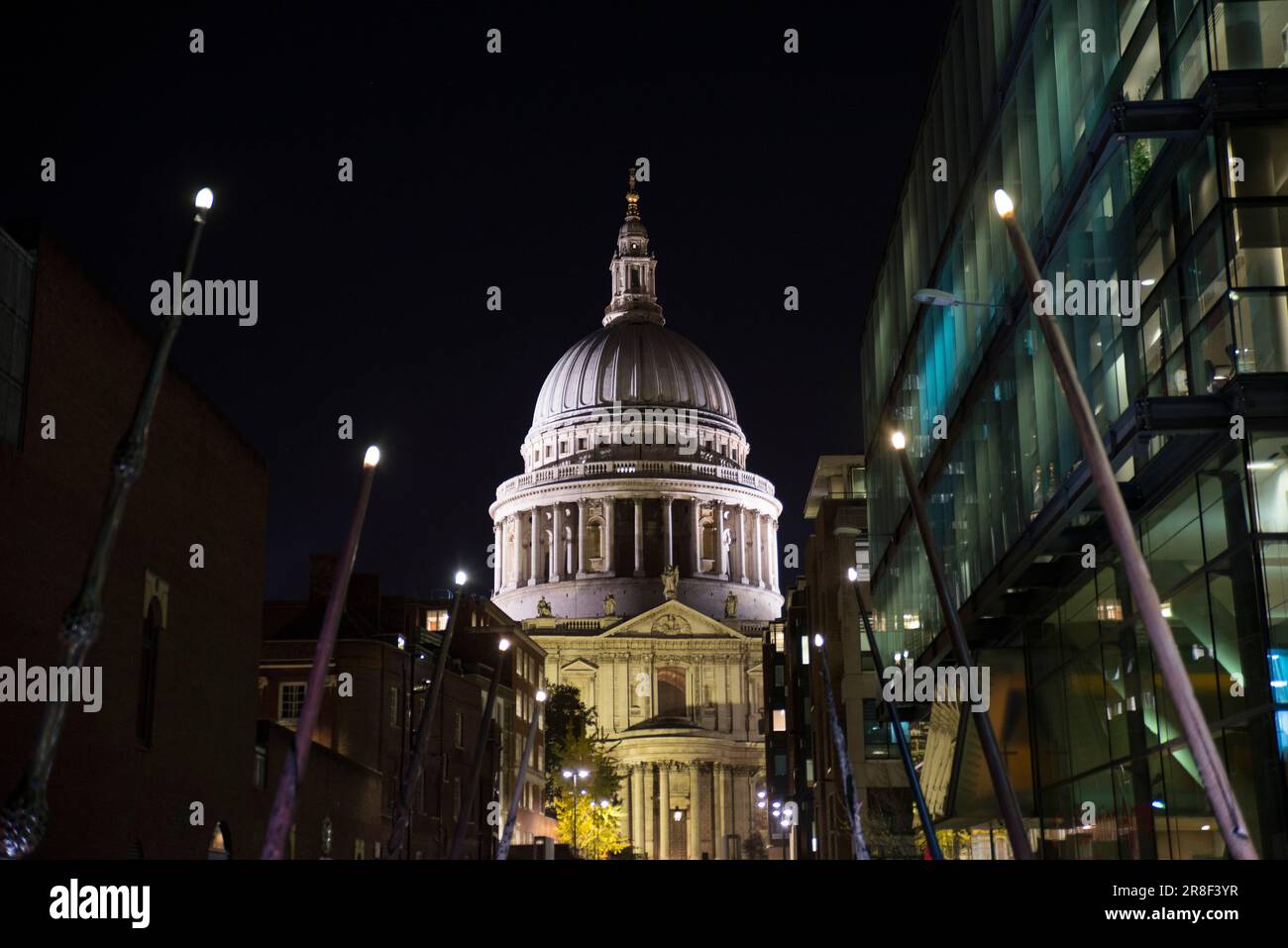 Wands from Harry Potter illuminating St Paul's cathedral at night Stock Photo