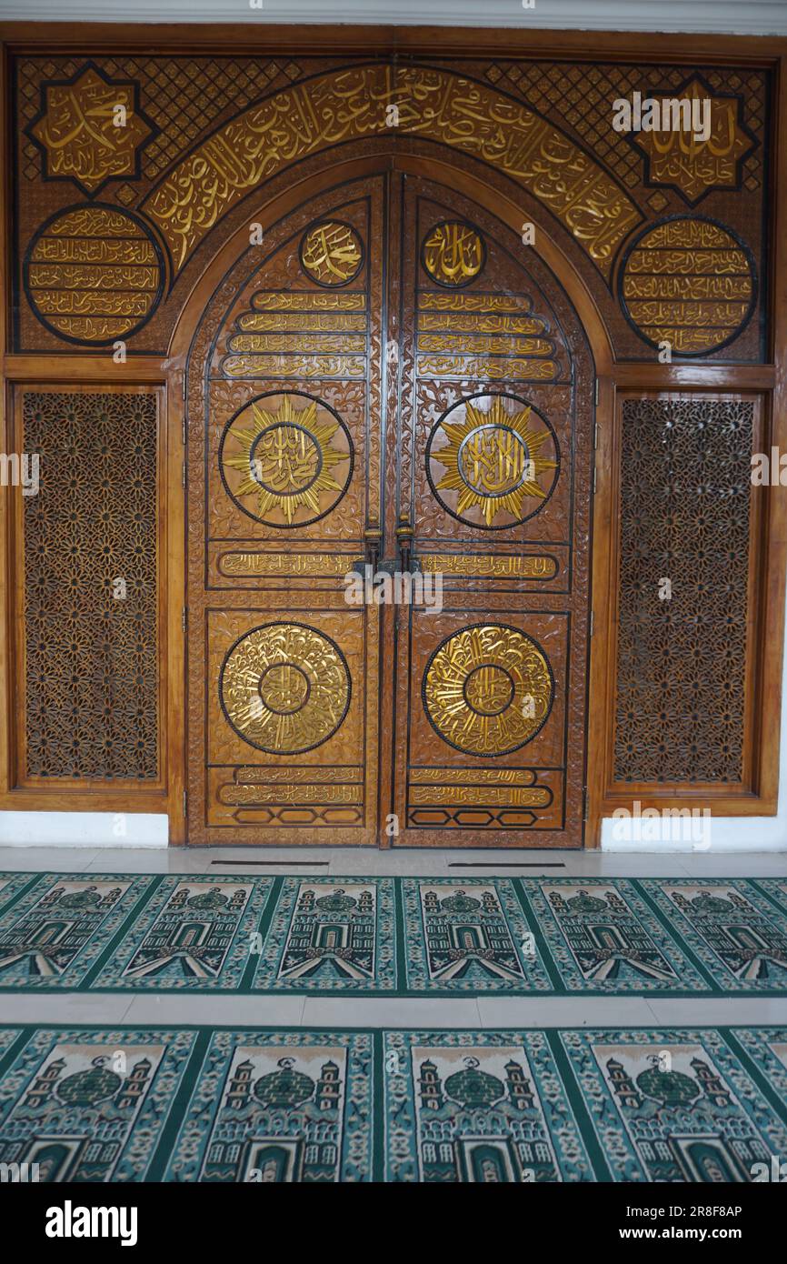Very beautiful wood carving at the entrance of the mosque Stock Photo