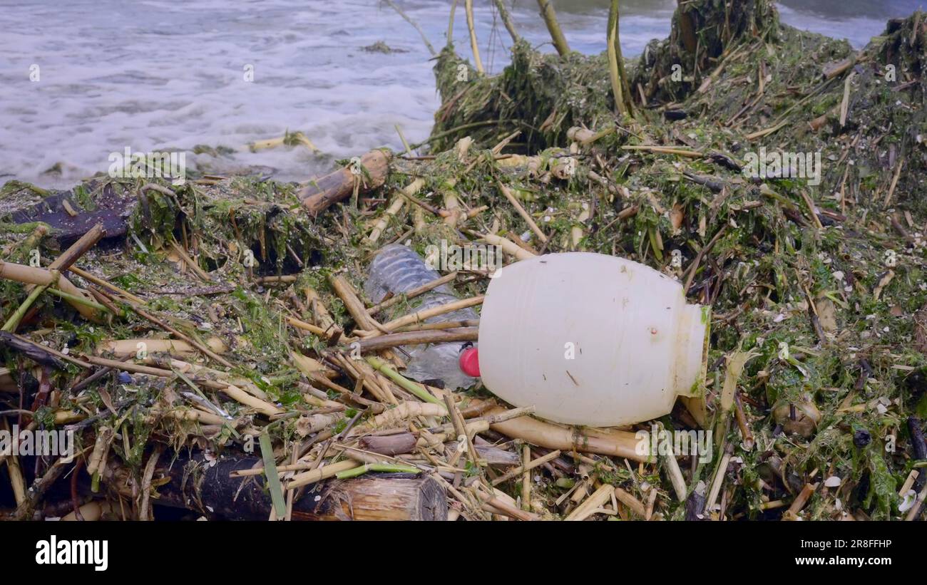 Plastic and other drifting debris has reached Black Sea beaches in Odessa, Ukraine. Environmental disaster caused by the explosion of Kakhovka Stock Photo