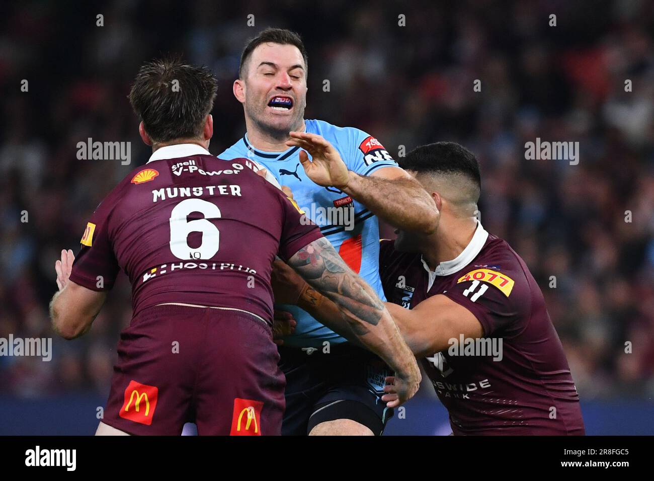 Brisbane, Australia. 21st June, 2023. James Tedesco of the Blues is tackled by Cameron Munster and David Fifita of the Maroons during State of Origin game 2 between the Queensland Maroons and the NSW Blues at Suncorp Stadium in Brisbane, Wednesday, June 21, 2023. (AAP Image/Jono Searle) NO ARCHIVING, EDITORIAL USE ONLY Credit: Australian Associated Press/Alamy Live News Stock Photo