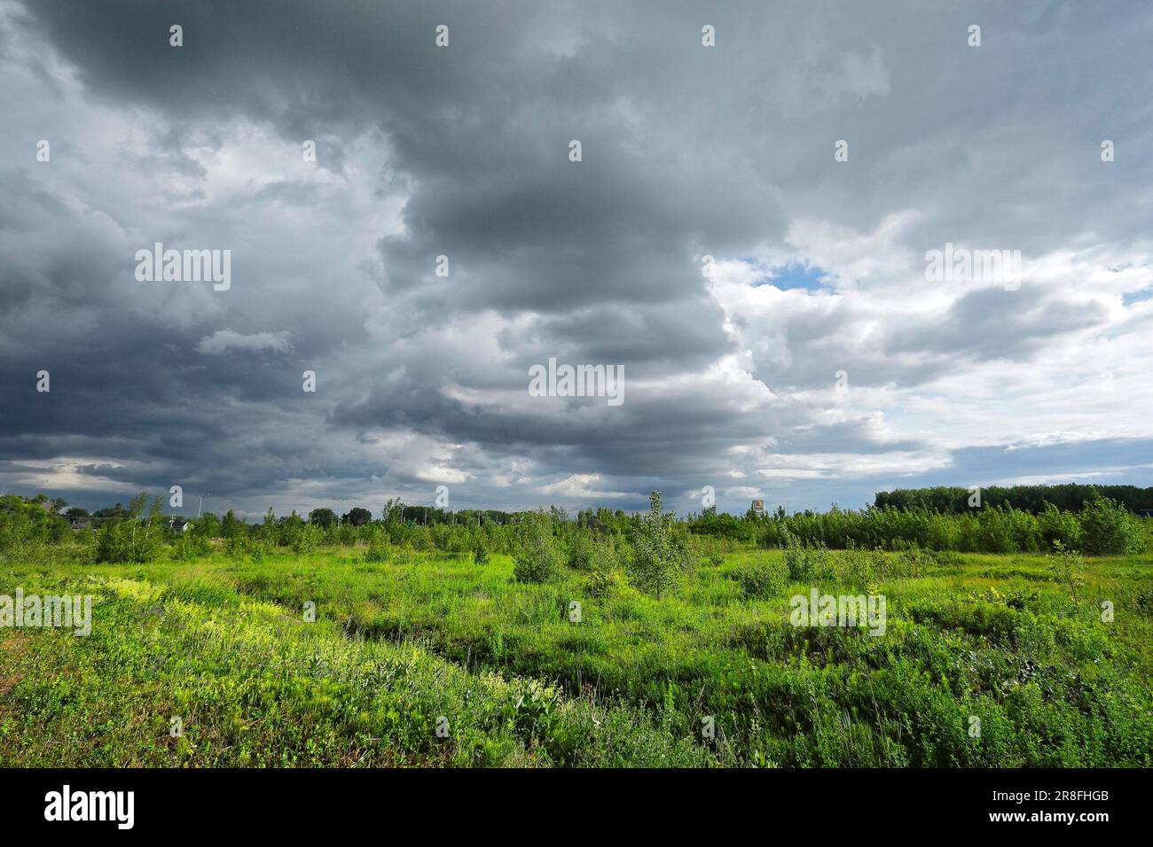 Nature, dark storm clouds over farmland, Province of Quebec Canada Stock Photo