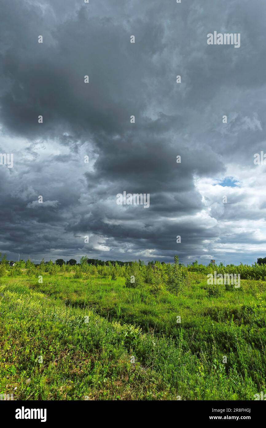 Nature, dark storm clouds over farmland, Province of Quebec Canada Stock Photo