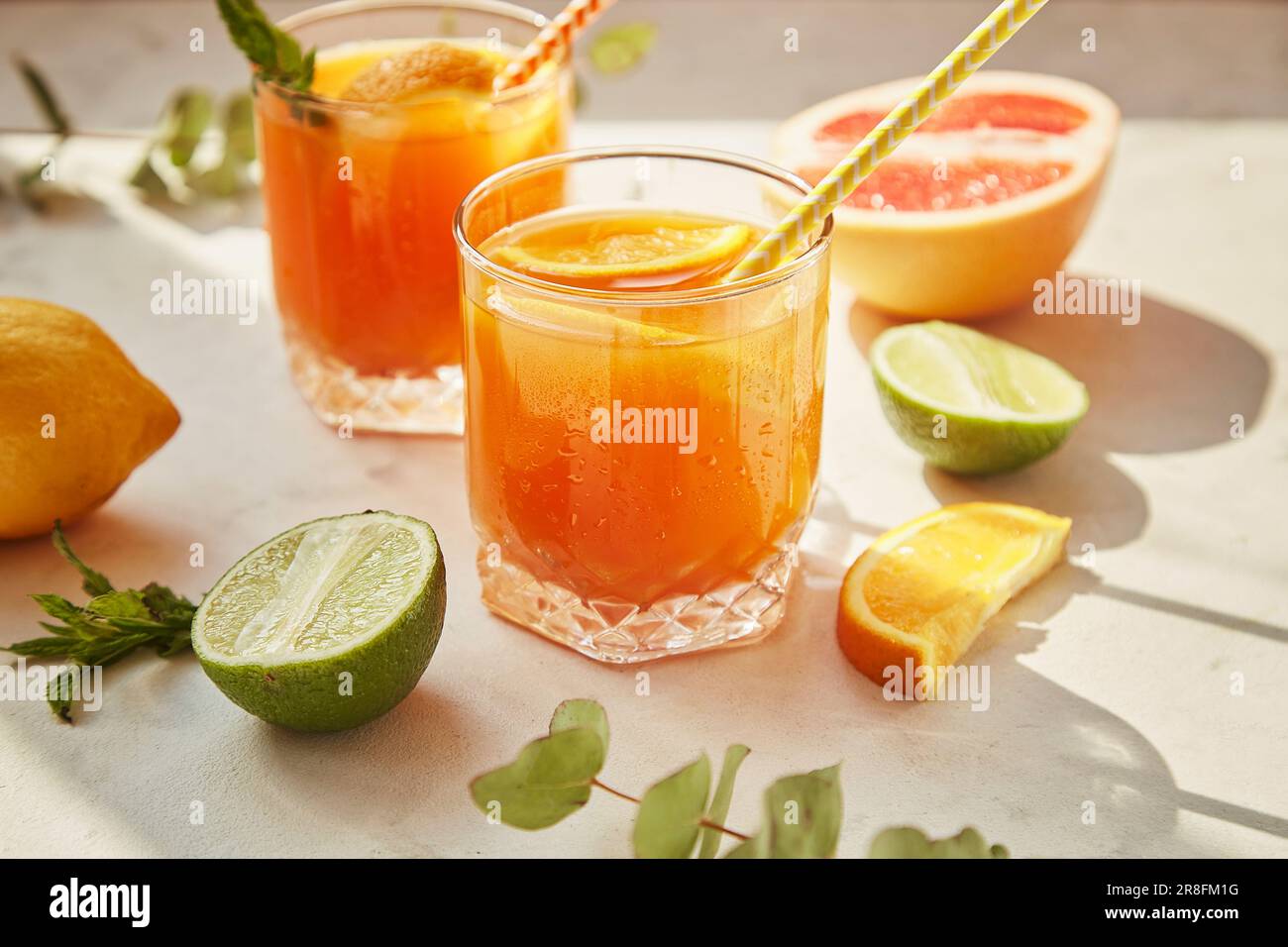 https://c8.alamy.com/comp/2R8FM1G/summer-orange-cocktails-with-fresh-citrus-fruits-hard-seltzer-lemonade-refreshing-drinks-low-alcohol-mocktails-summer-party-concept-shadow-and-s-2R8FM1G.jpg