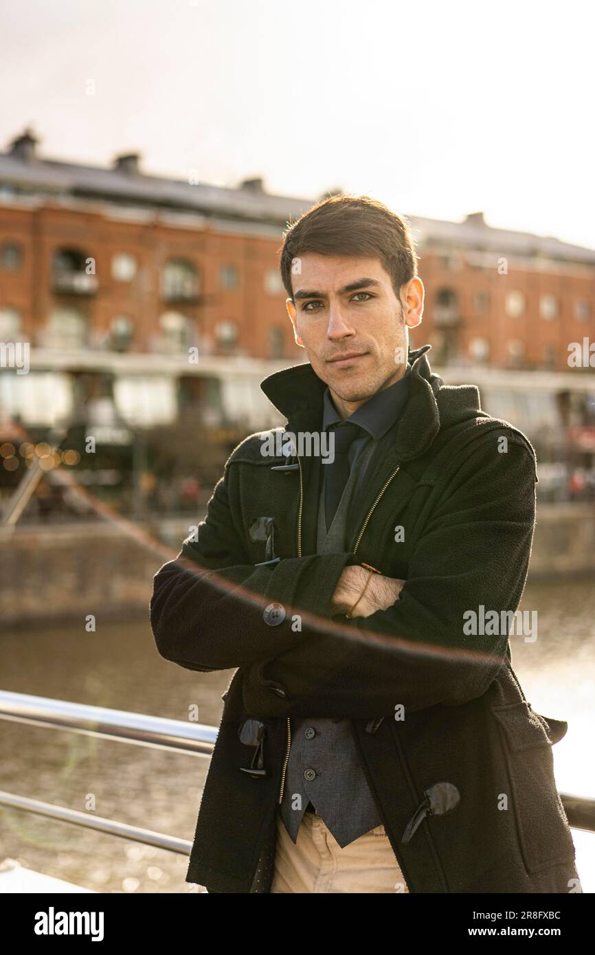 Portrait of an attractive male tourist looking at camera in Puerto Madero, Buenos Aires, Argentina Stock Photo