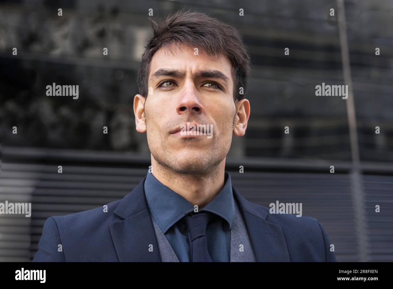 Low-angle view of an attractive executive man looking away Stock Photo