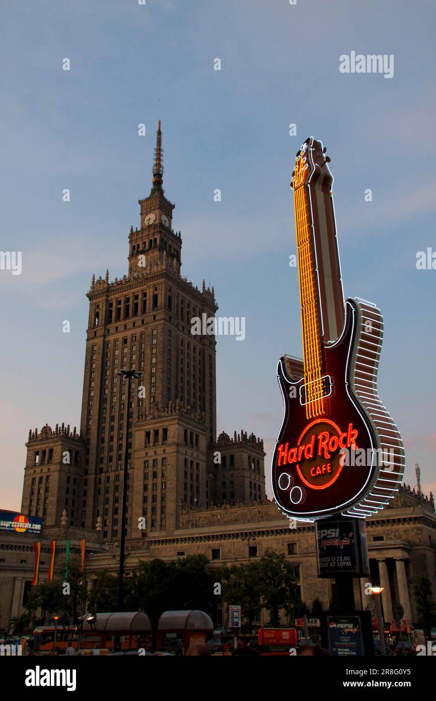 Advertisement for a Hard Rock Cafe against the backdrop of the Warsaw Palace of Culture Poland Stock Photo