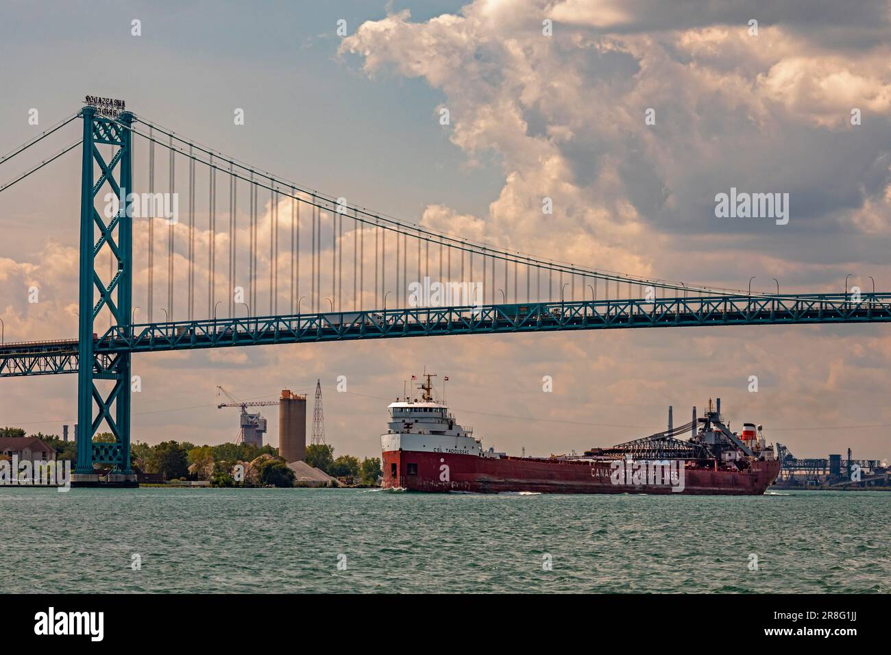 Detroit, Michigan, The CSL Tadoussac, a self-unloading bulk carrier operated by Canada Steamship Lines, sails upbound on the Detroit River, passing Stock Photo