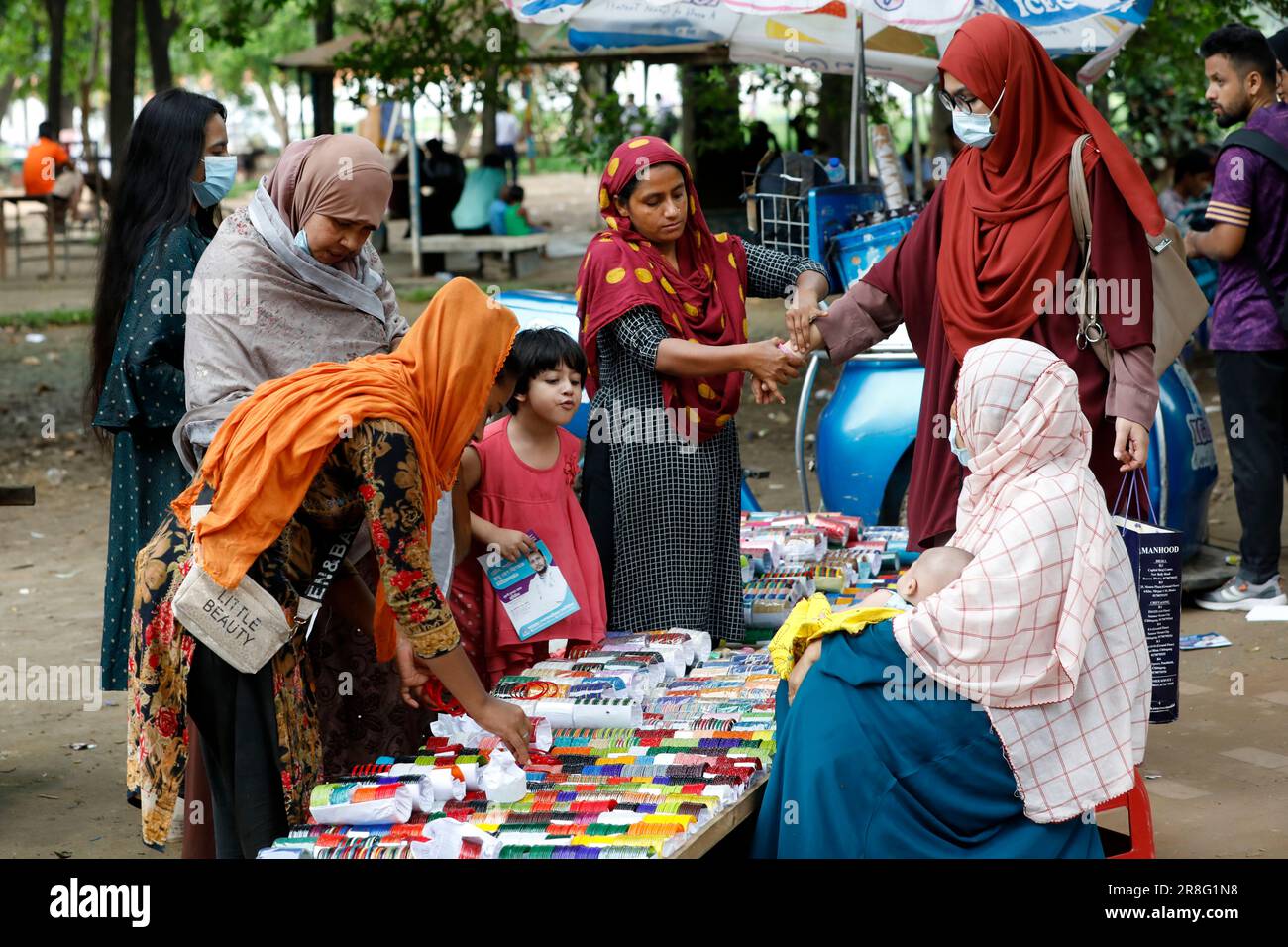 Dhaka, Bangladesh June 20, 2023 A vendor is selling traditional Bengali glass bangles on the