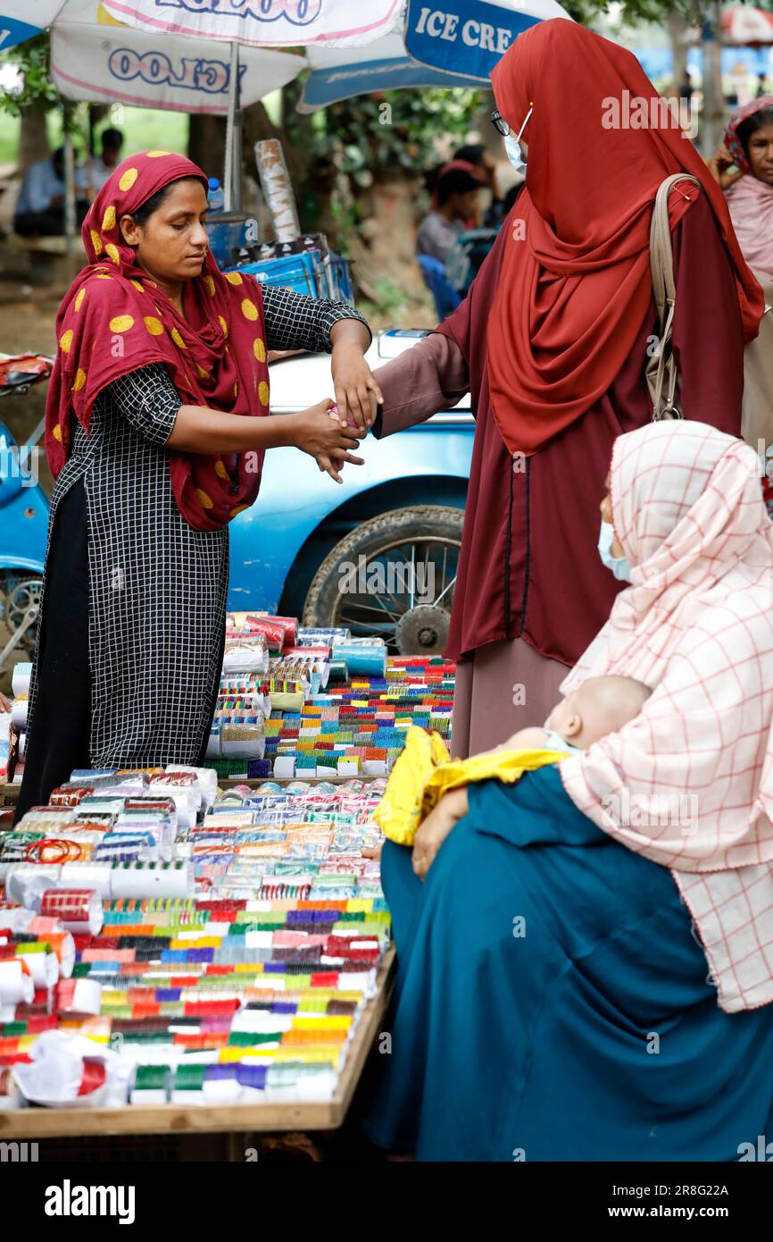 Dhaka, Bangladesh - June 20, 2023: A vendor is selling traditional ...