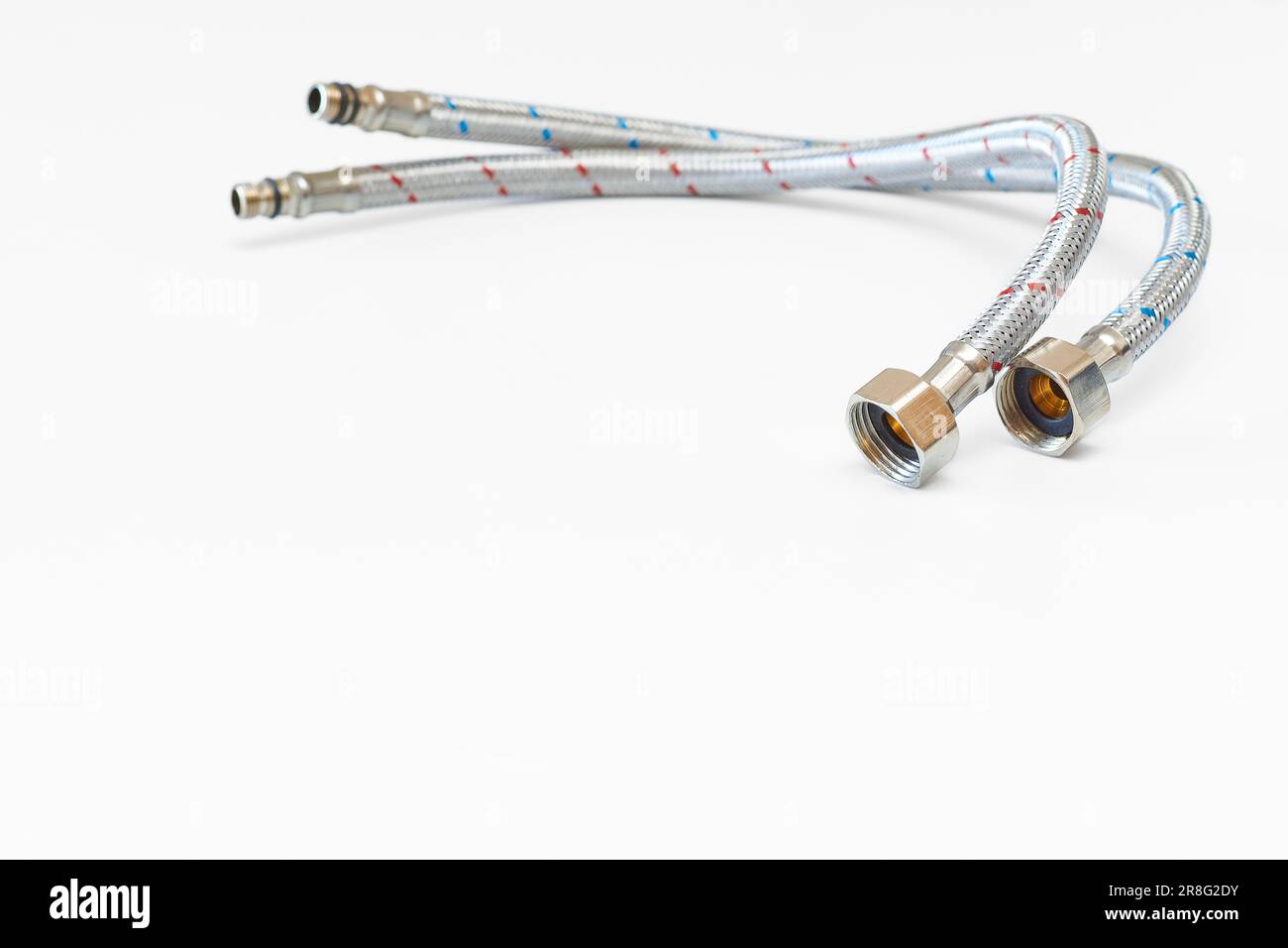 Plumbing. Flexible metal stainless steel faucet hoses Stock Photo
