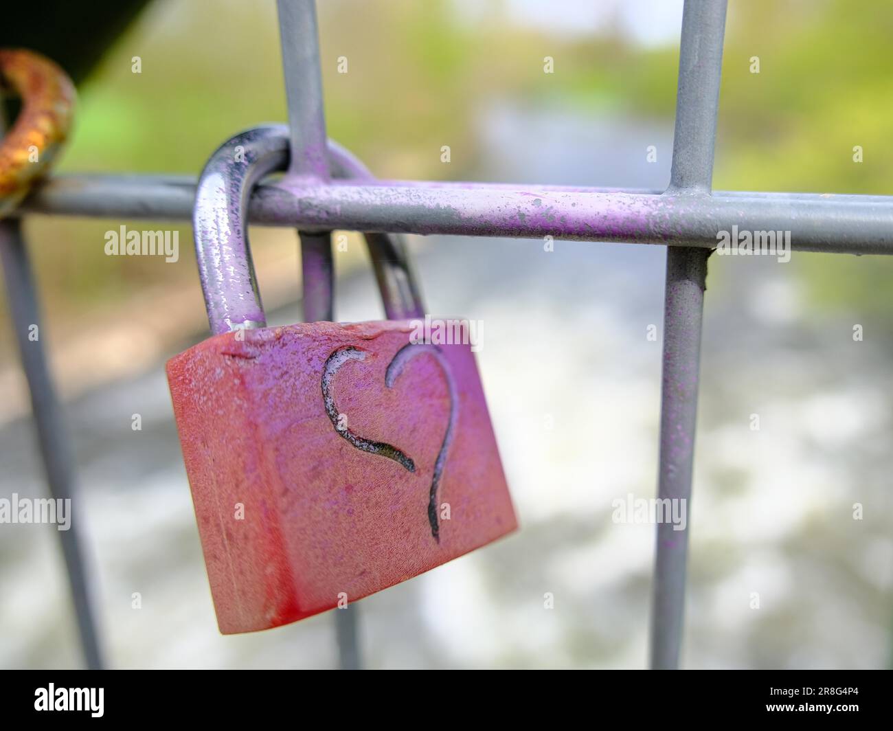 Love lock on a bridge, blurred background, Lower Rhine, North Rhine-Westphalia, Germany Stock Photo