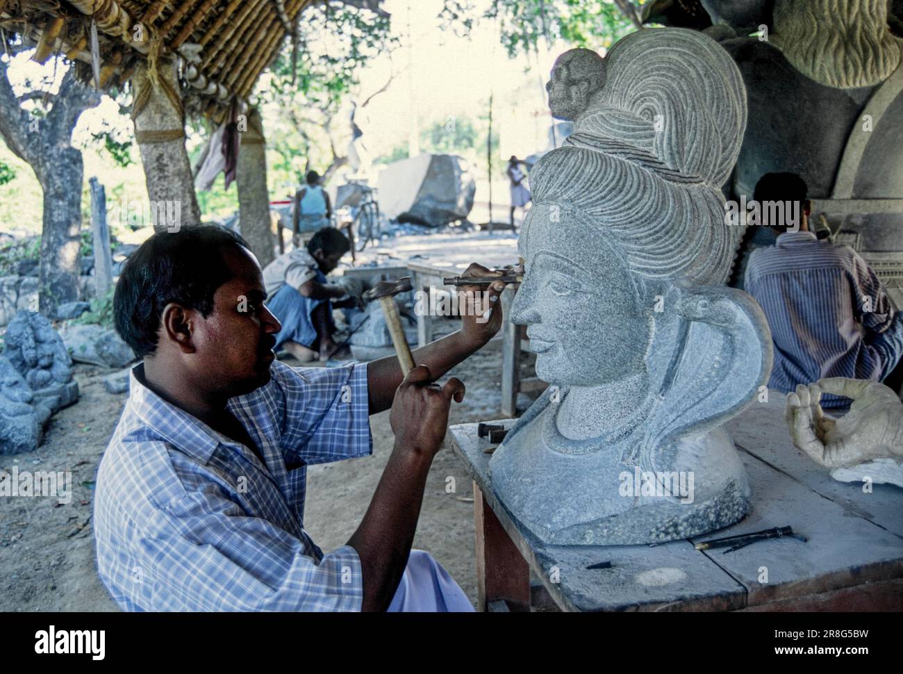 A stone sculptor at work in Mahabalipuram Mamallapuram near Chennai, Tamil Nadu, South India