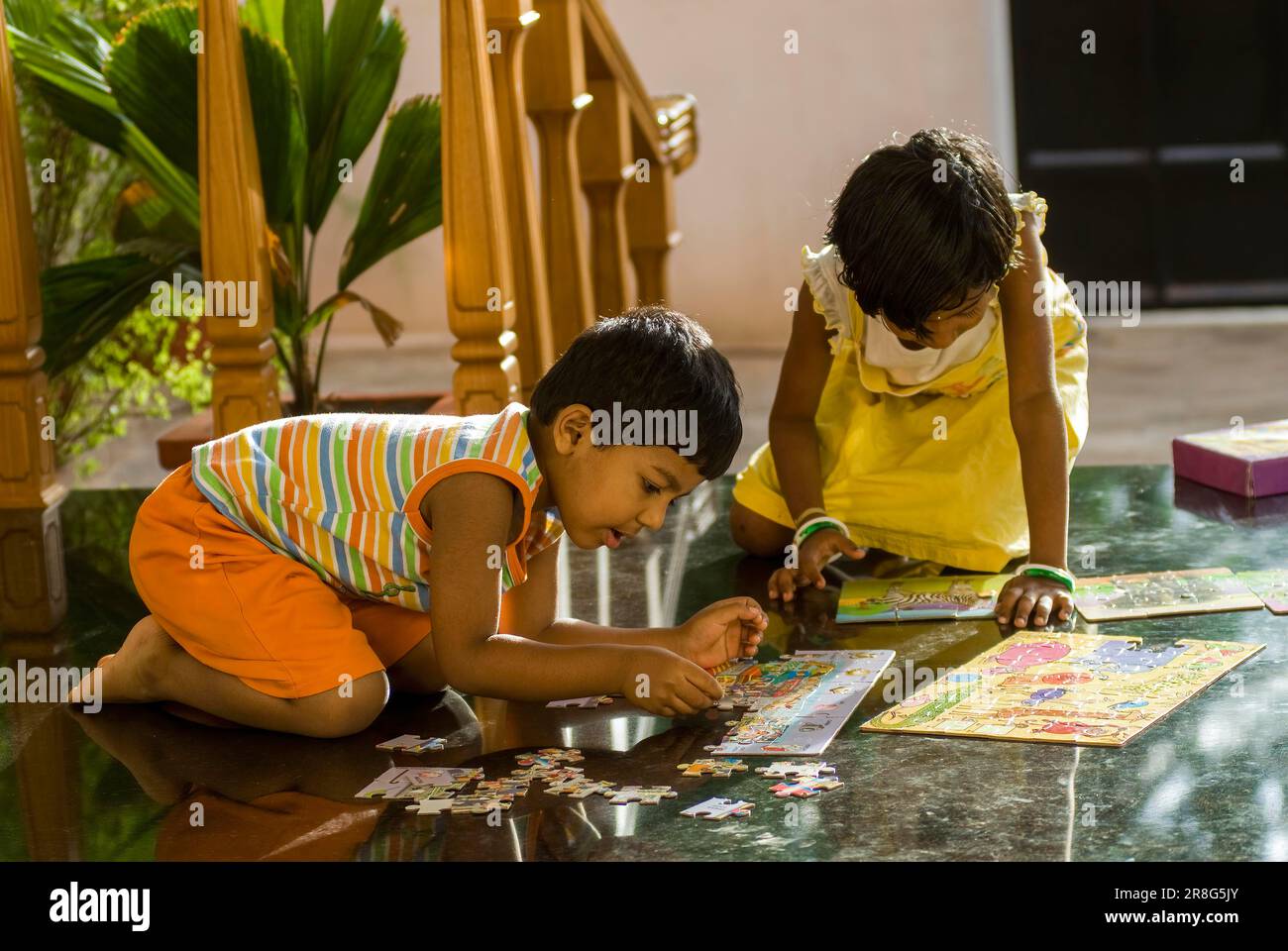 Brother (3year) and sister (7year) playing puzzle game, Coimbatore