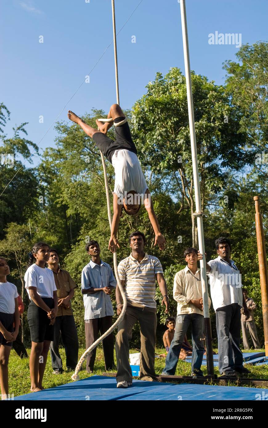 A girl performing Indian Pole Gymnastics, Mallakhamba mallakhamb is an