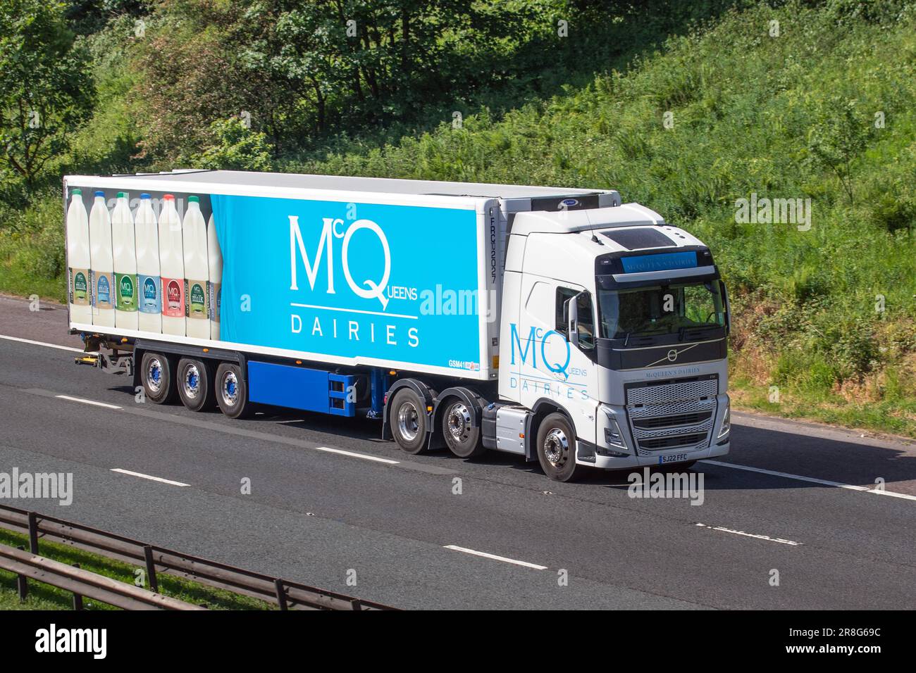 McQueens Dairies milk delivery service lorry; travelling on the M6 motorway, UK Stock Photo Alamy