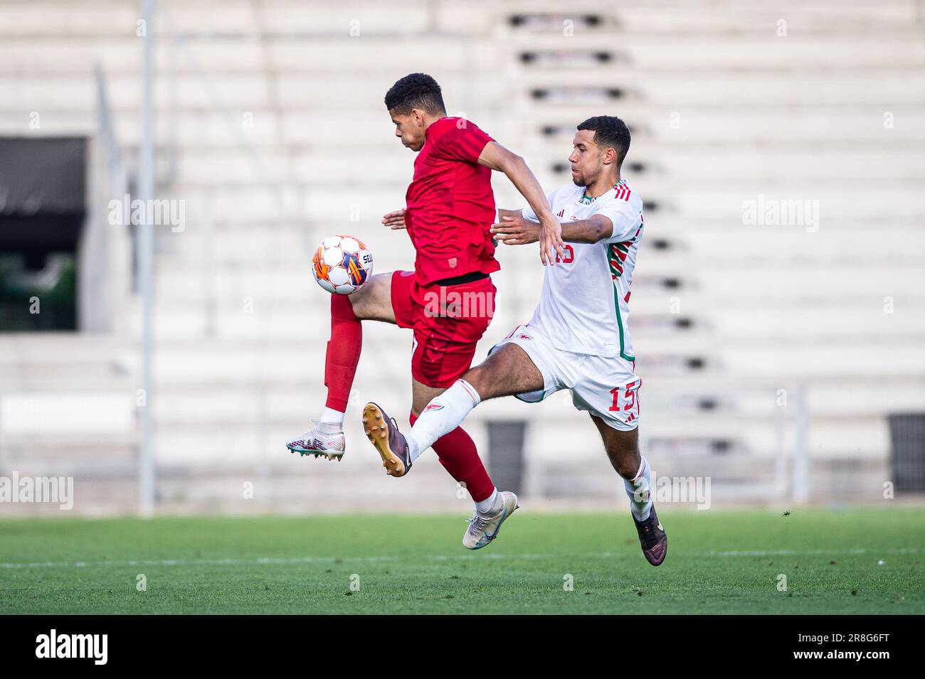 Vejle, Denmark. 20th June, 2023. William Osula (17) of Denmark and Luca Hoole (15) of Wales seen during the U21 Euro qualifier match between Denmark and Wales at Vejle Stadion in Vejle. (Photo Credit: Gonzales Photo/Alamy Live News Stock Photo