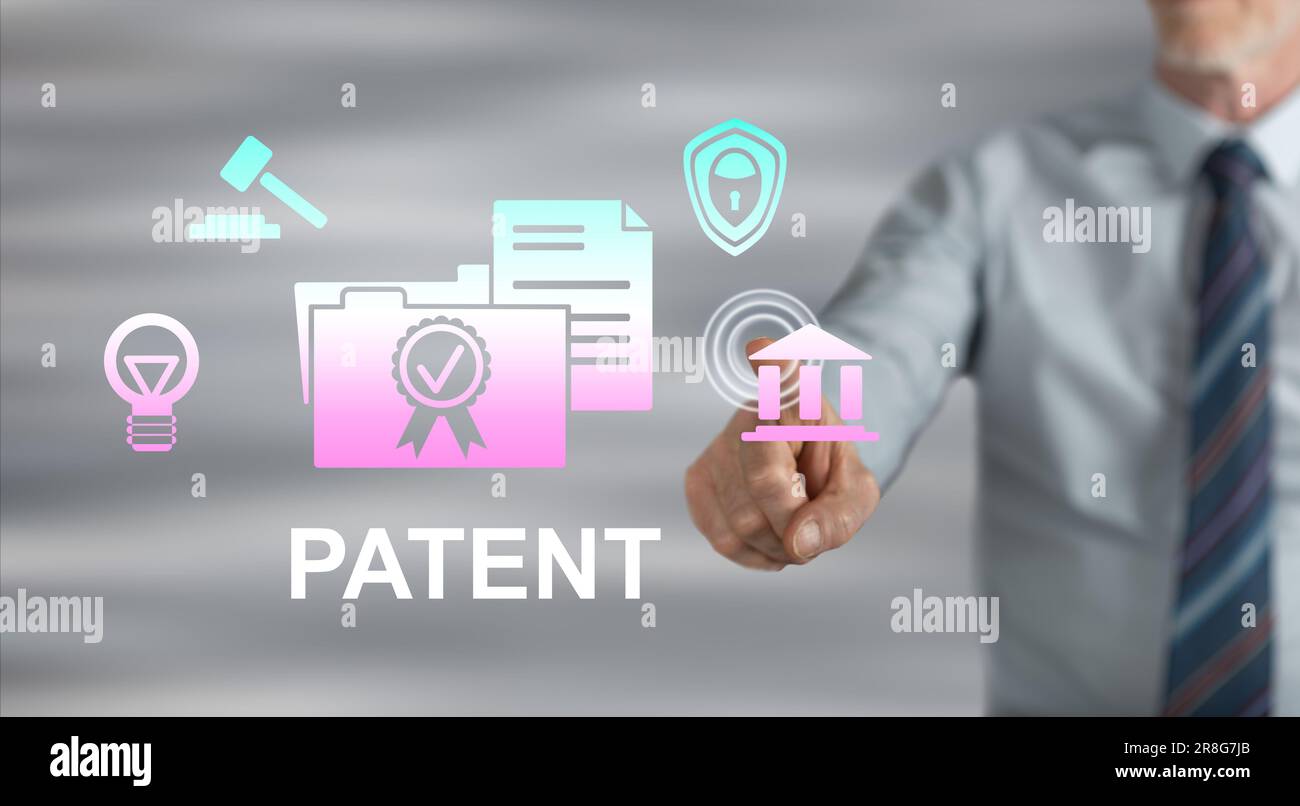 Man touching a patent concept on a touch screen with his finger Stock Photo