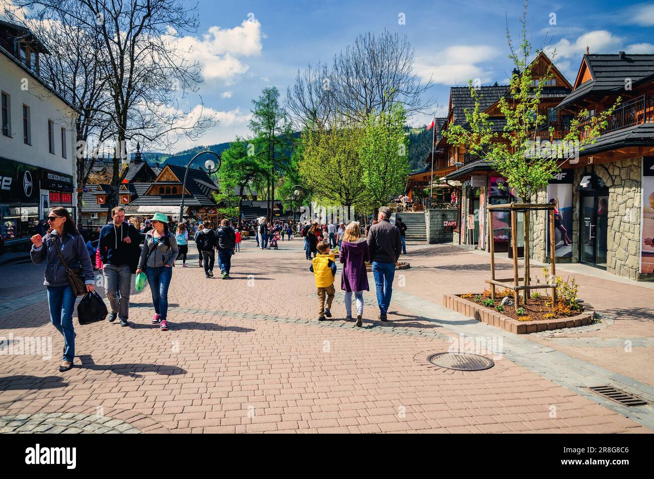 Zakopane, Poland - May 8, 2016: Tourists on a popular Krupowki street in Zakopane, Poland. Stock Photo