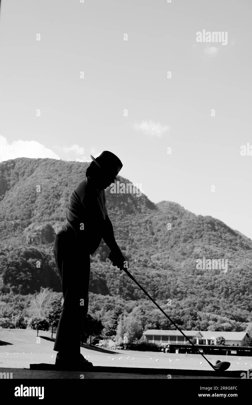 Golfer on Driving Range with Mountain in Switzerland Stock Photo Alamy