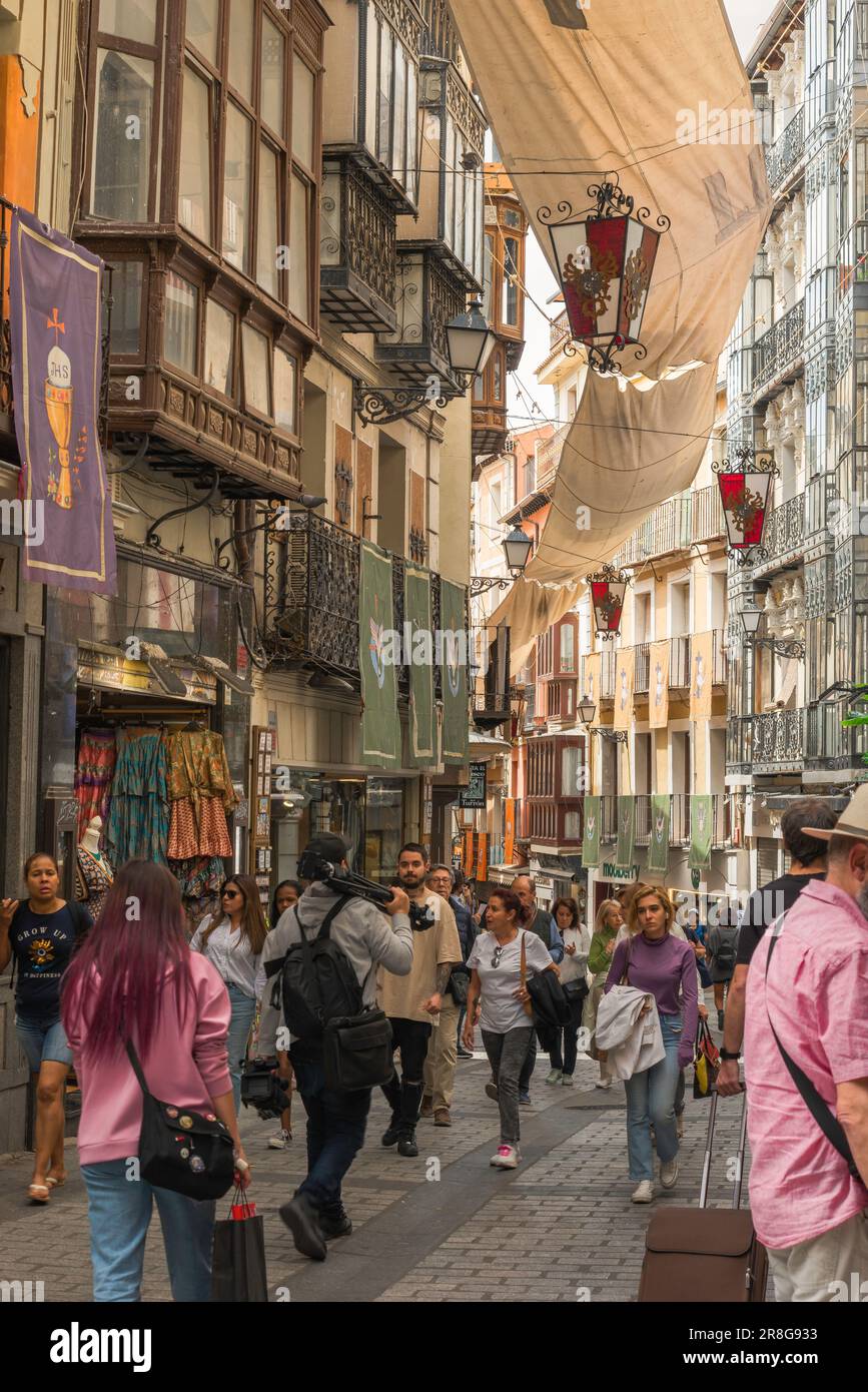 Toledo shopping street, view of people walking in the Calle Commercio, a popular shopping street in the historic Old Town center of Toledo, Spain Stock Photo